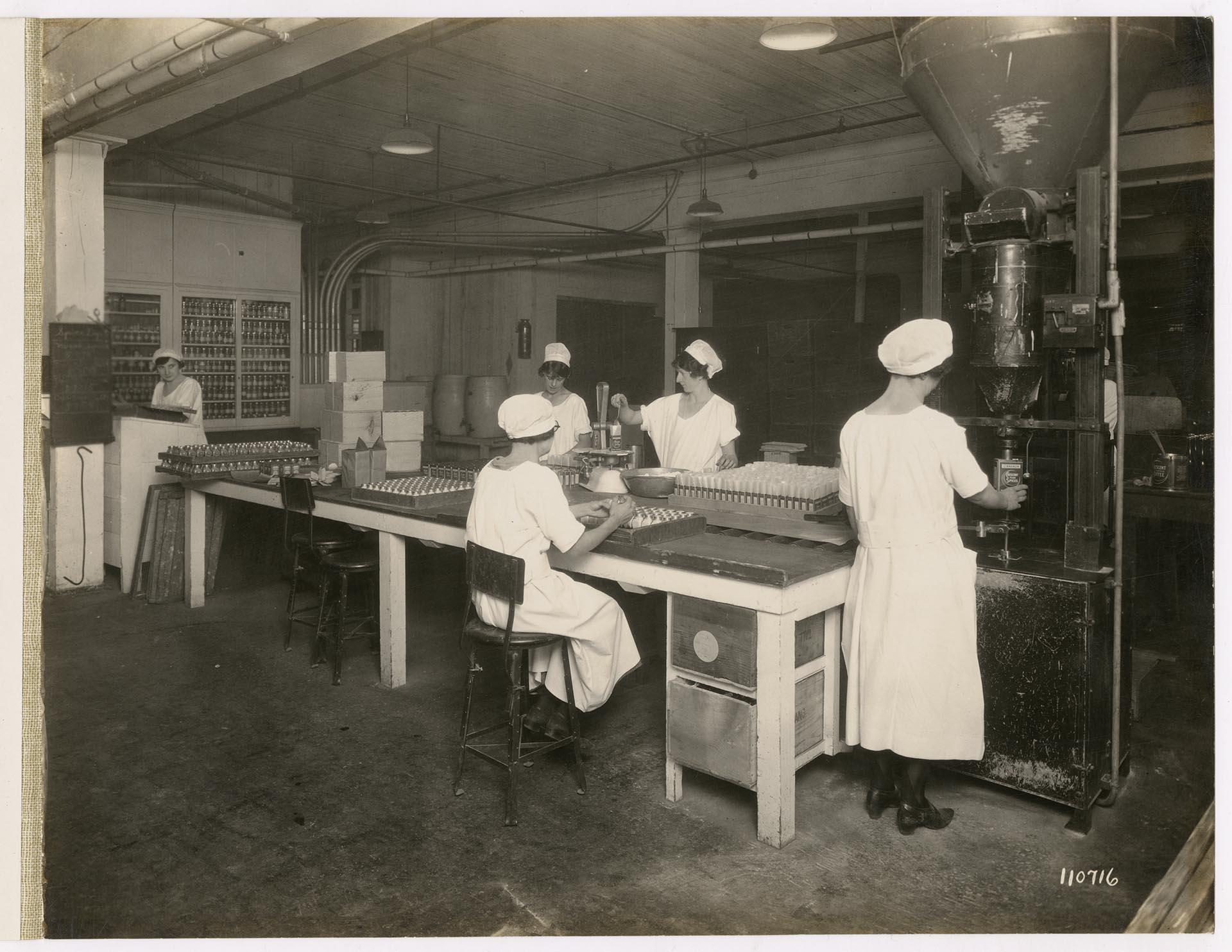 Image of Employees at work in the spice packing department at  Crescent Manufacturing Company, Seattle, circa 1923