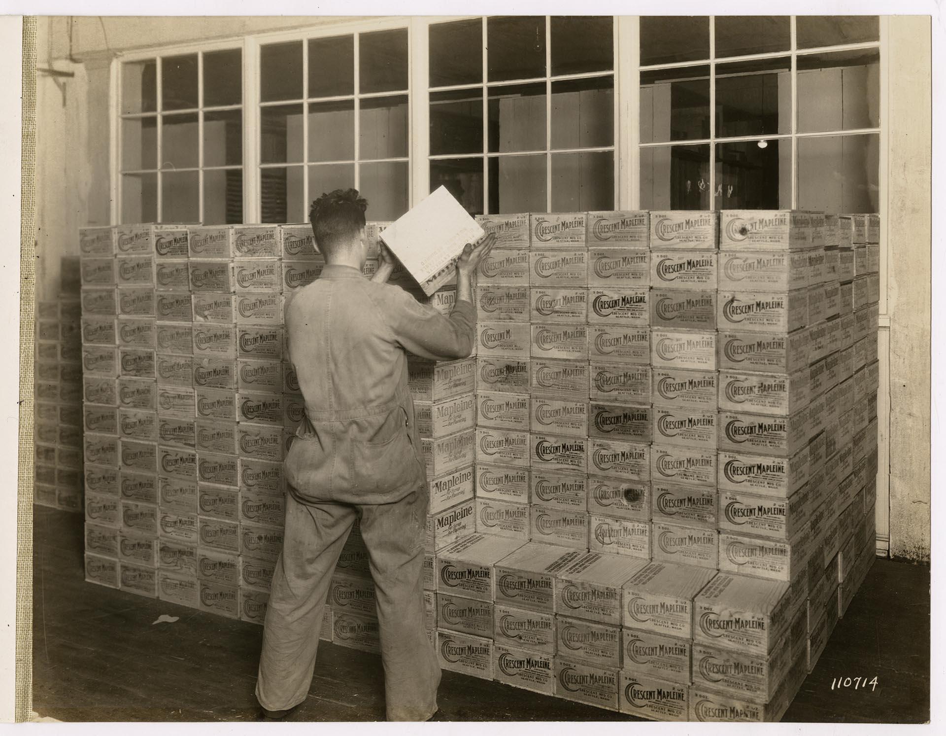 Image of Employee working in the stockroom at Crescent Manufacturing Company, Seattle, circa 1923