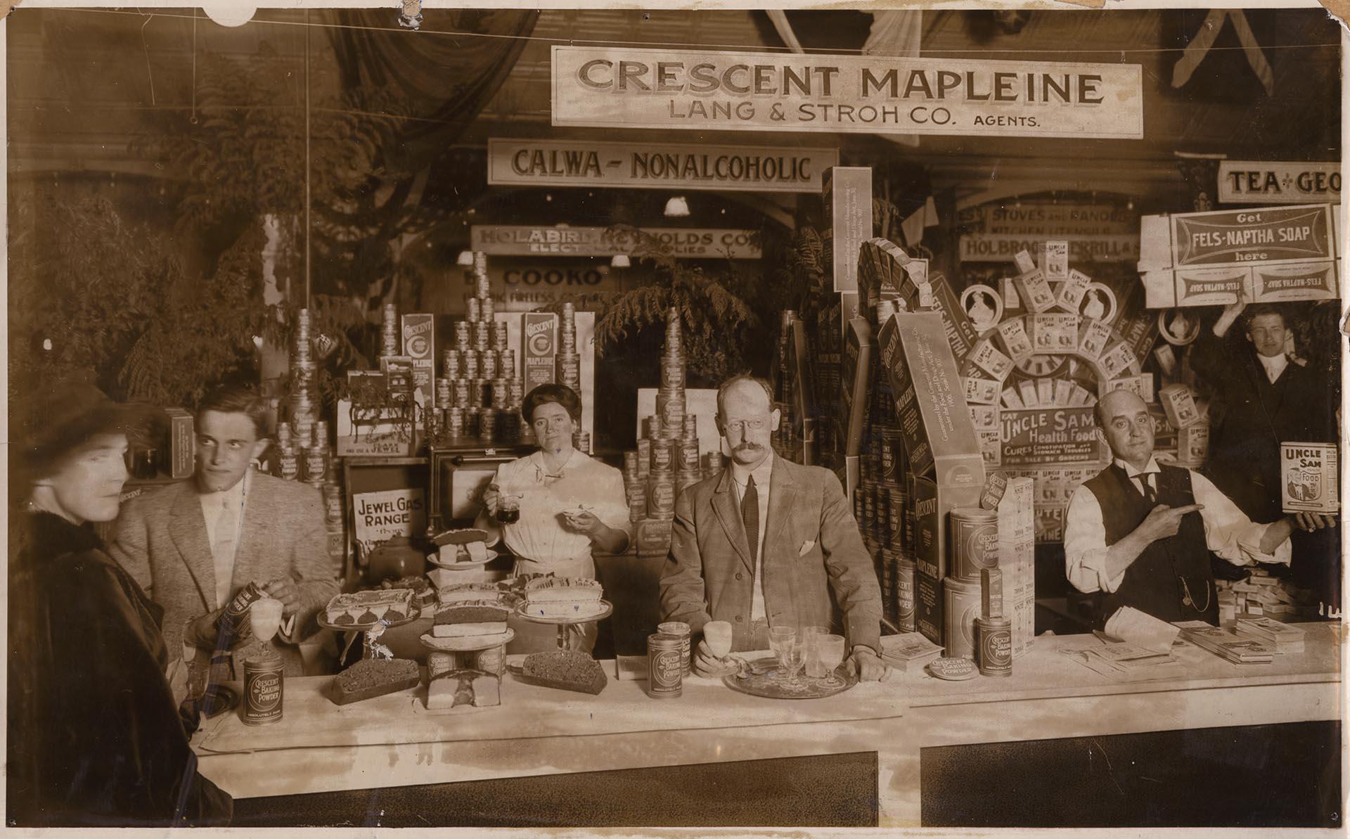 Image of Employees with a display of Mapleine and other Crescent Manufacturing Company products , Seattle, circa 1910