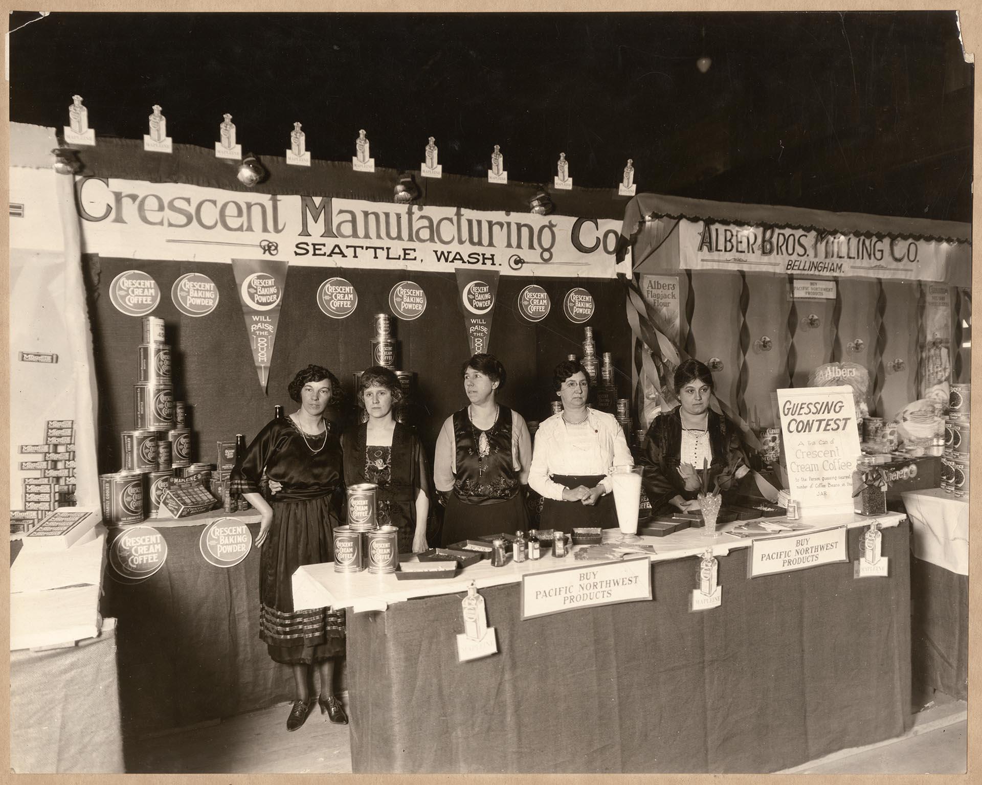 Image of Employees with Crescent Manufacturing Company products at a coffee exhibit in Bellingham, 1922