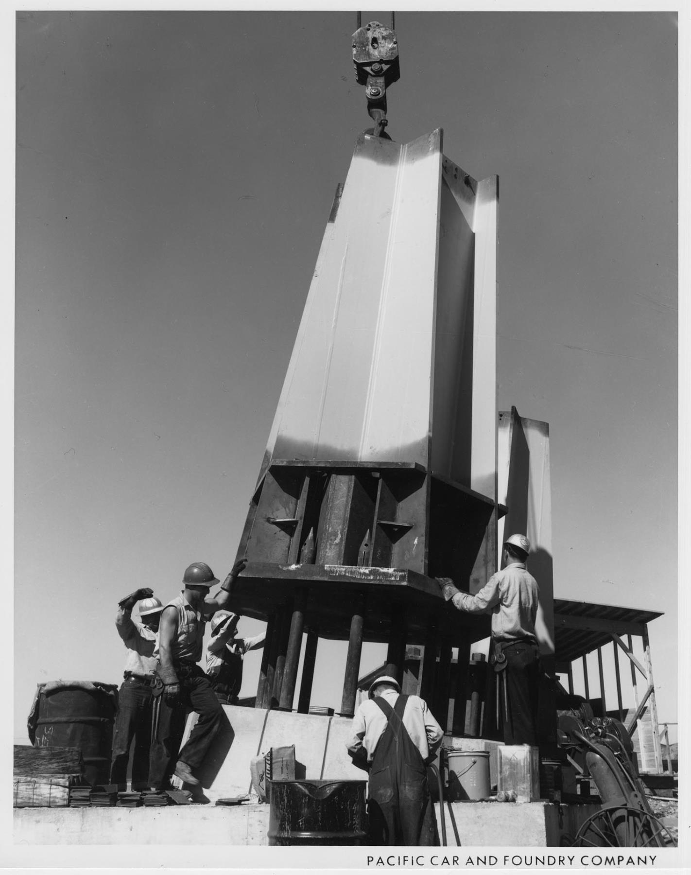 Image of Space Needle leg being set on base, 1961
