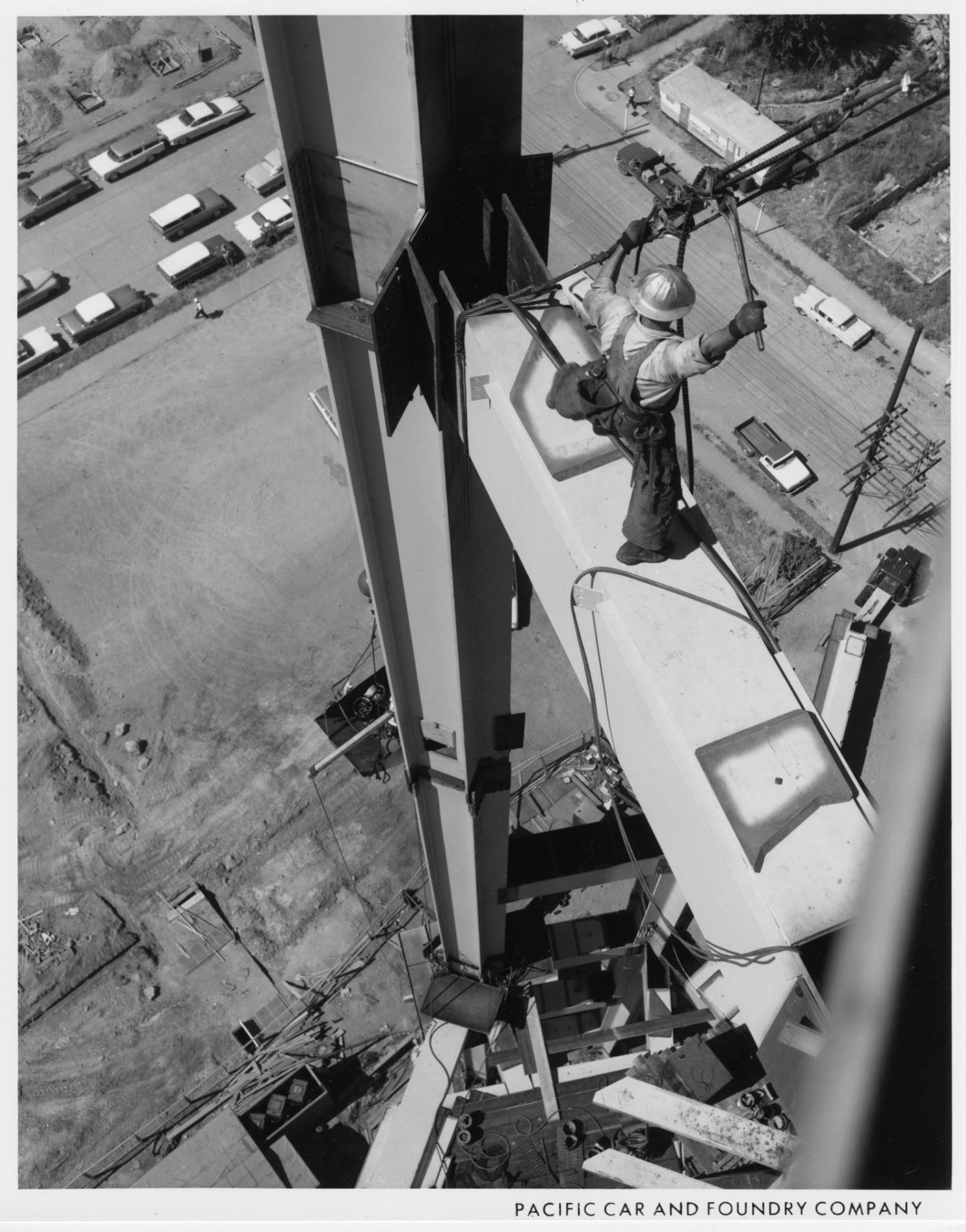 Image of Pacific Car and Foundry Co. worker tightening cable during Space Needle construction, 1961