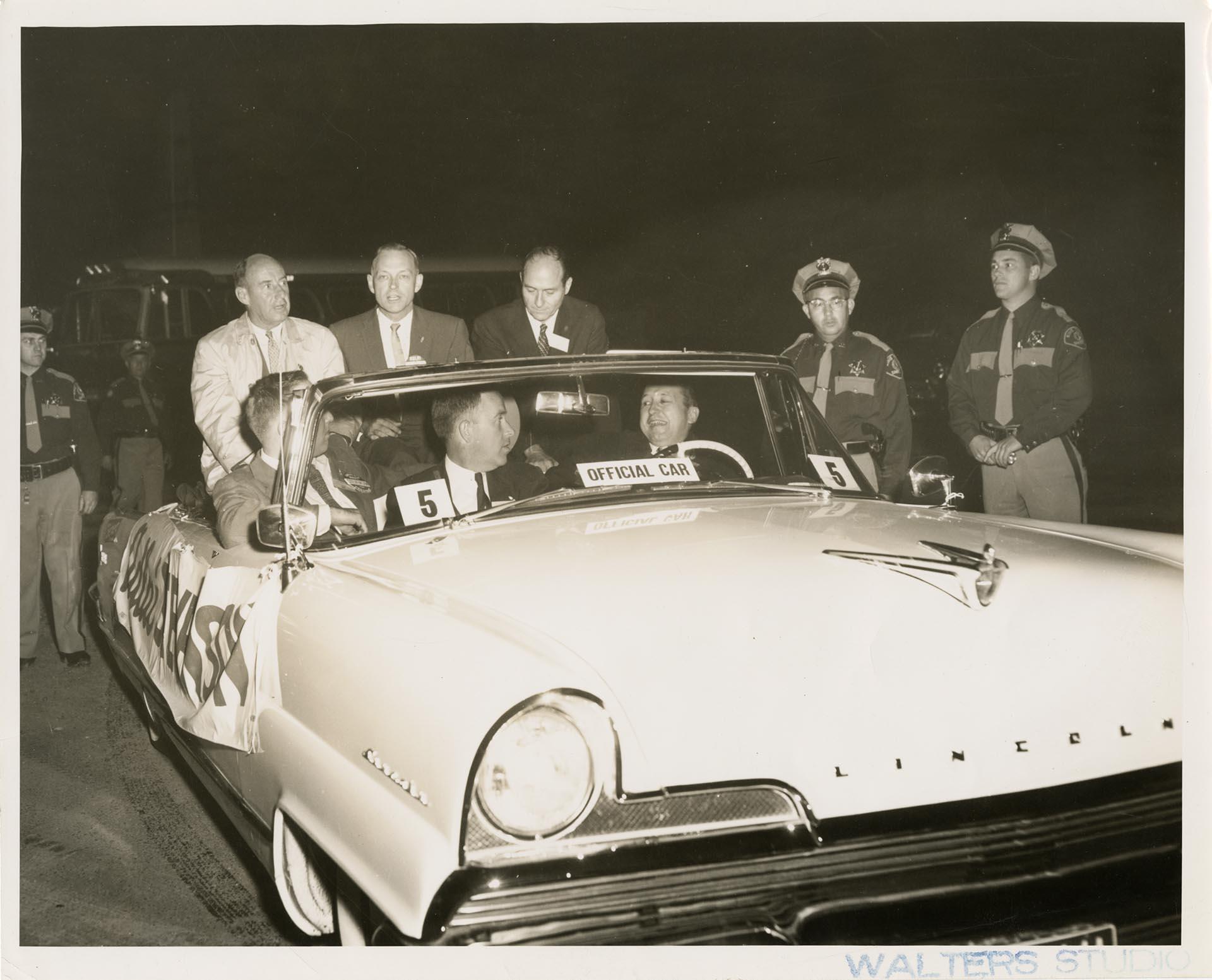 Image of Adlai Stevenson, Don Magnuson, Al Rossellini, Henry Jackson, and Max Antin seated in a Lincoln during a parade, Seattle, circa 1955