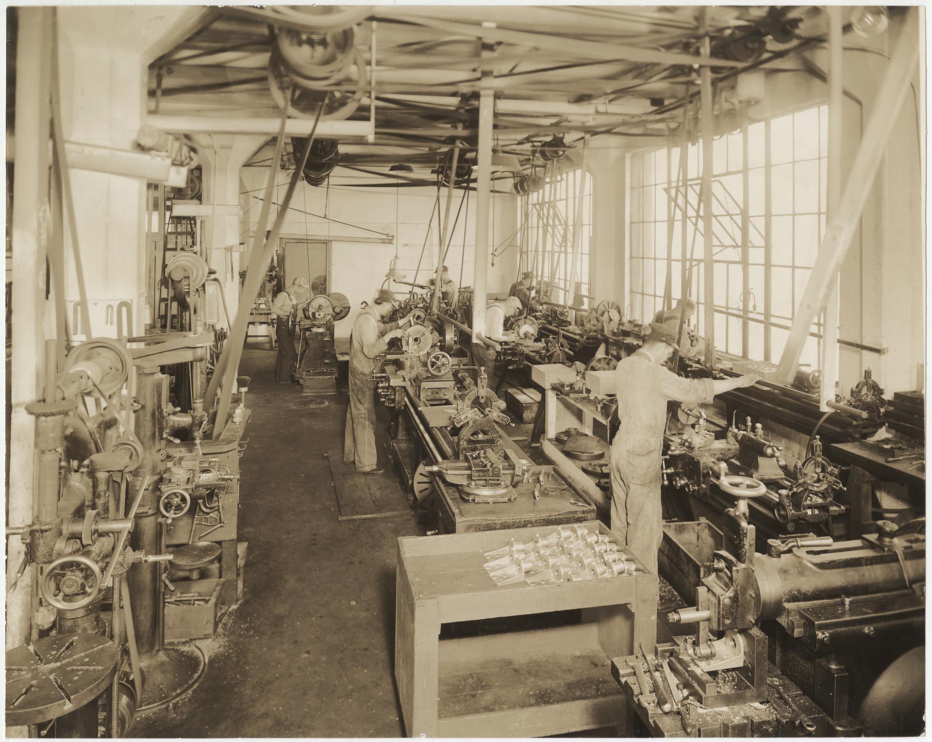 Image of Pacific Net & Twine employees working in machine shop, Seattle, circa 1930