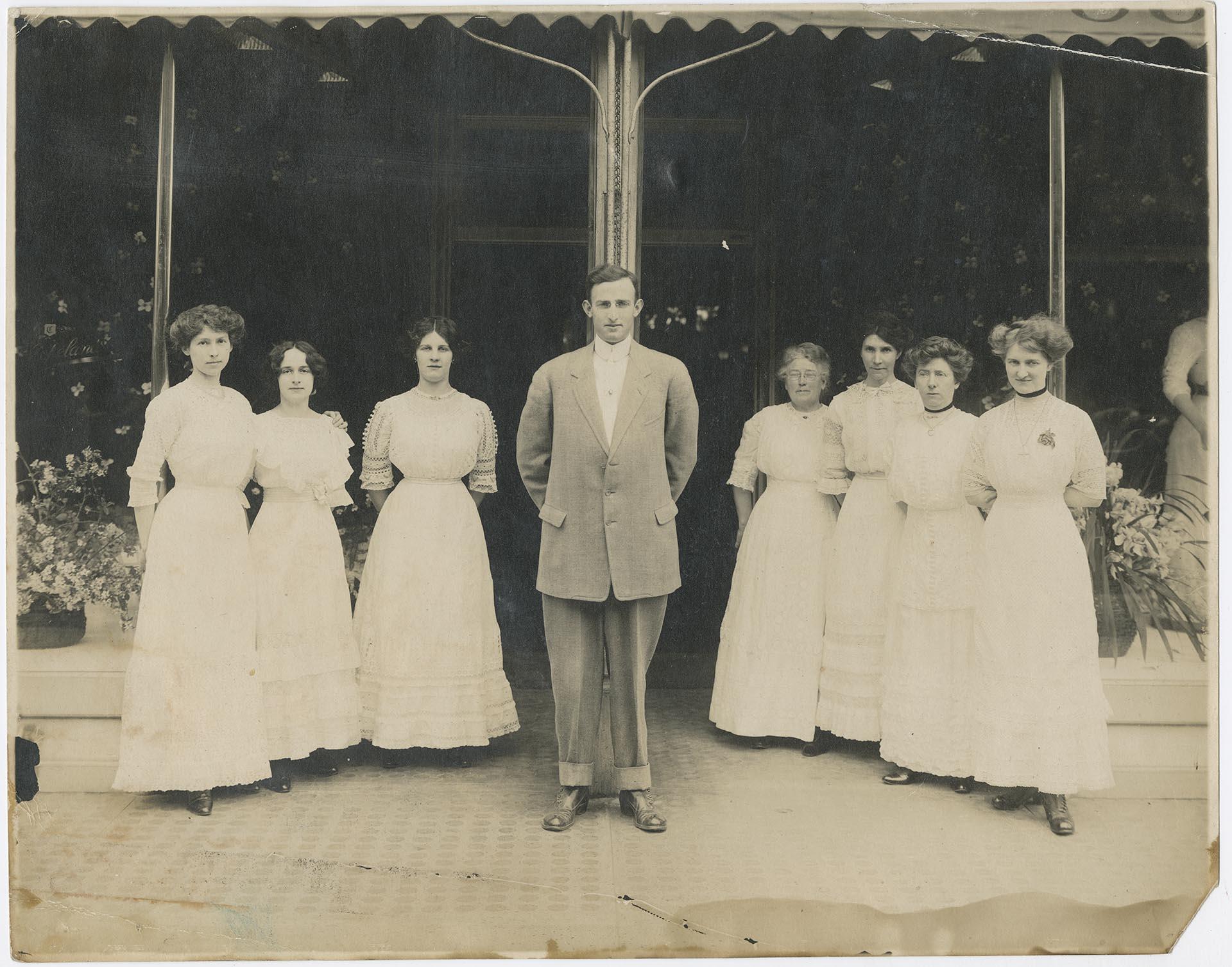 Image of Pacific Outfitting Company employees outside storefront, Seattle, circa 1915