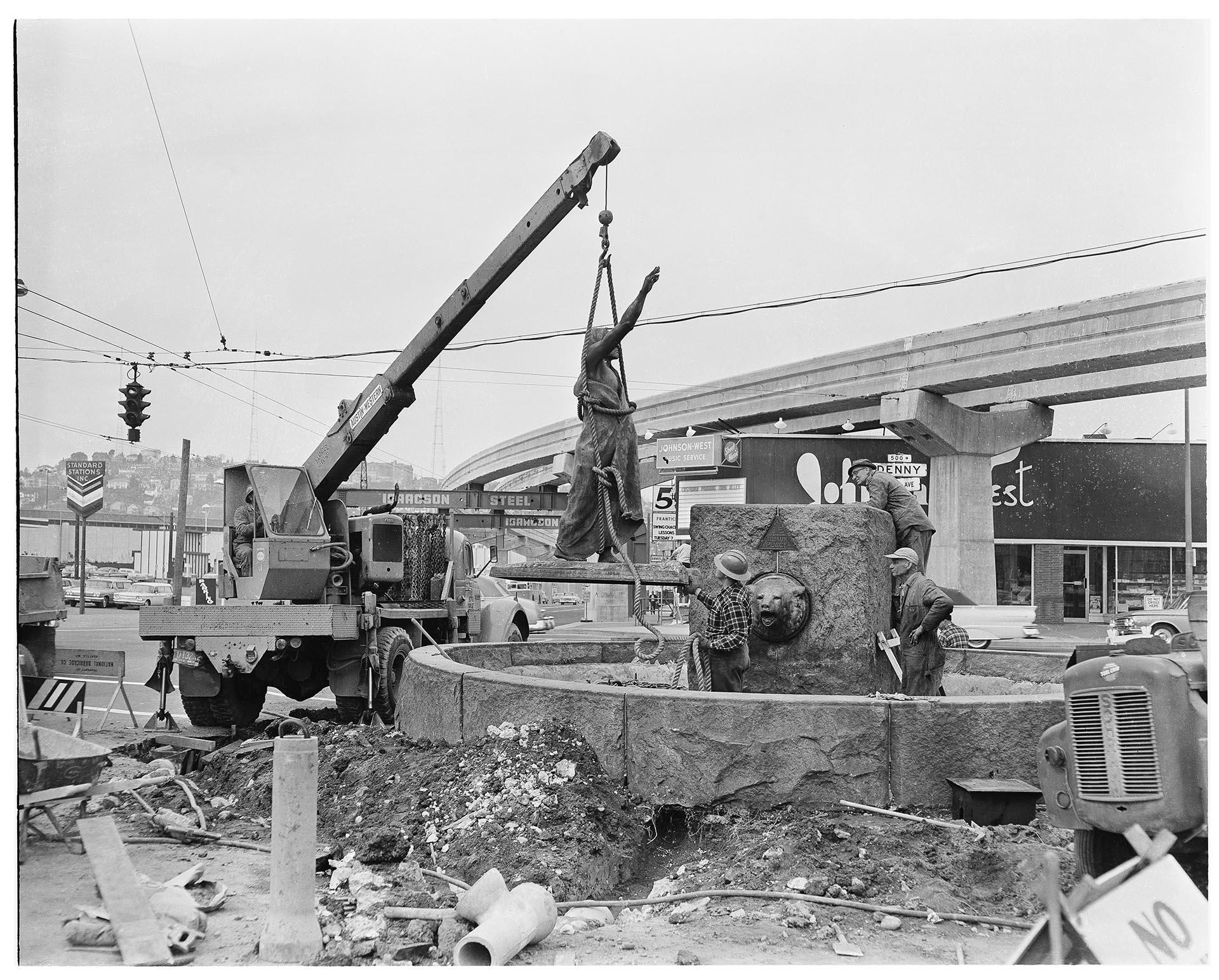 Image of Removal of Chief Si'ahl (Chief Seattle) statue for cleaning before the Century 21 Exposition, Seattle, 1962