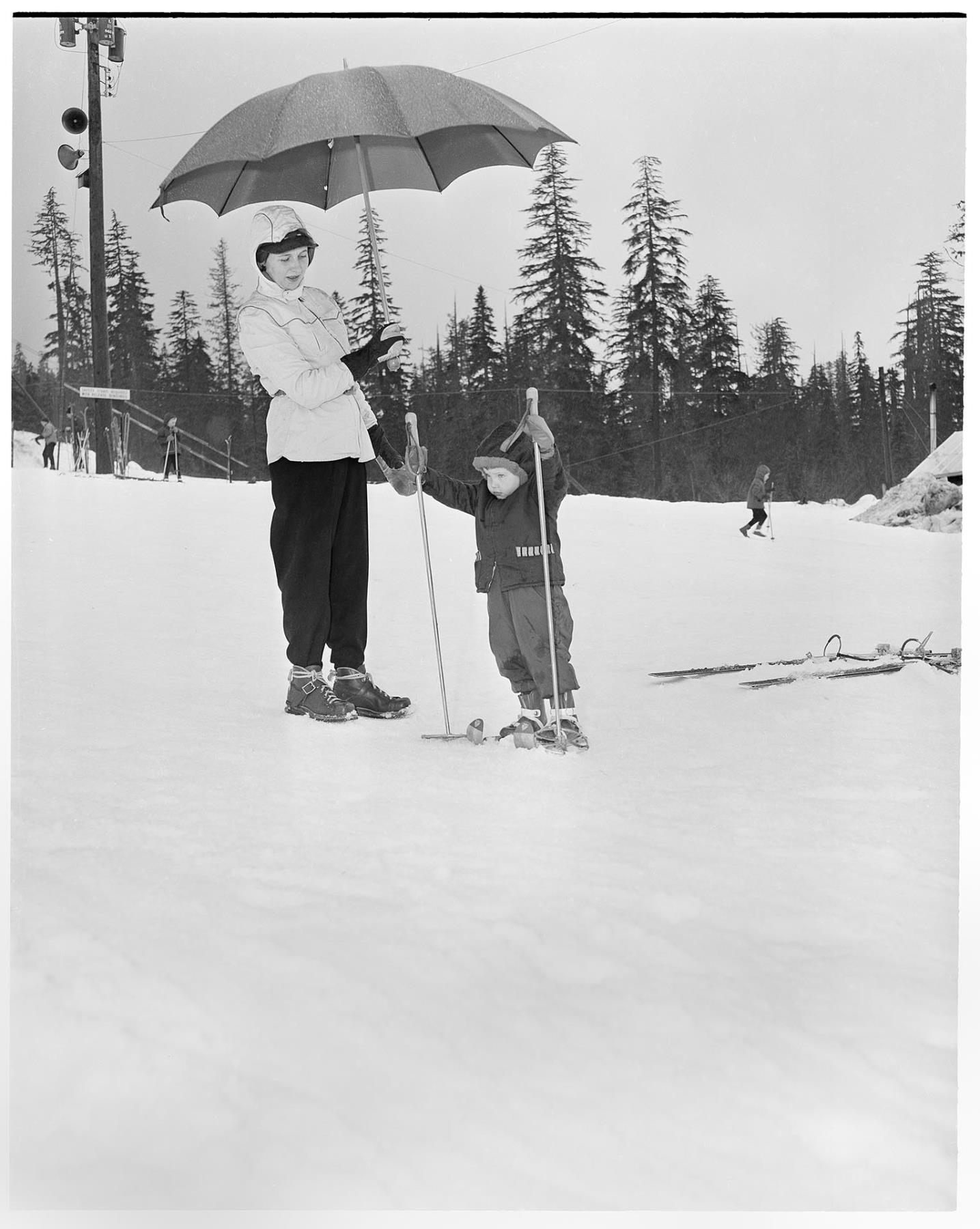 Image of Ski school student and instructor at Snoqualmie Summit, circa 1961