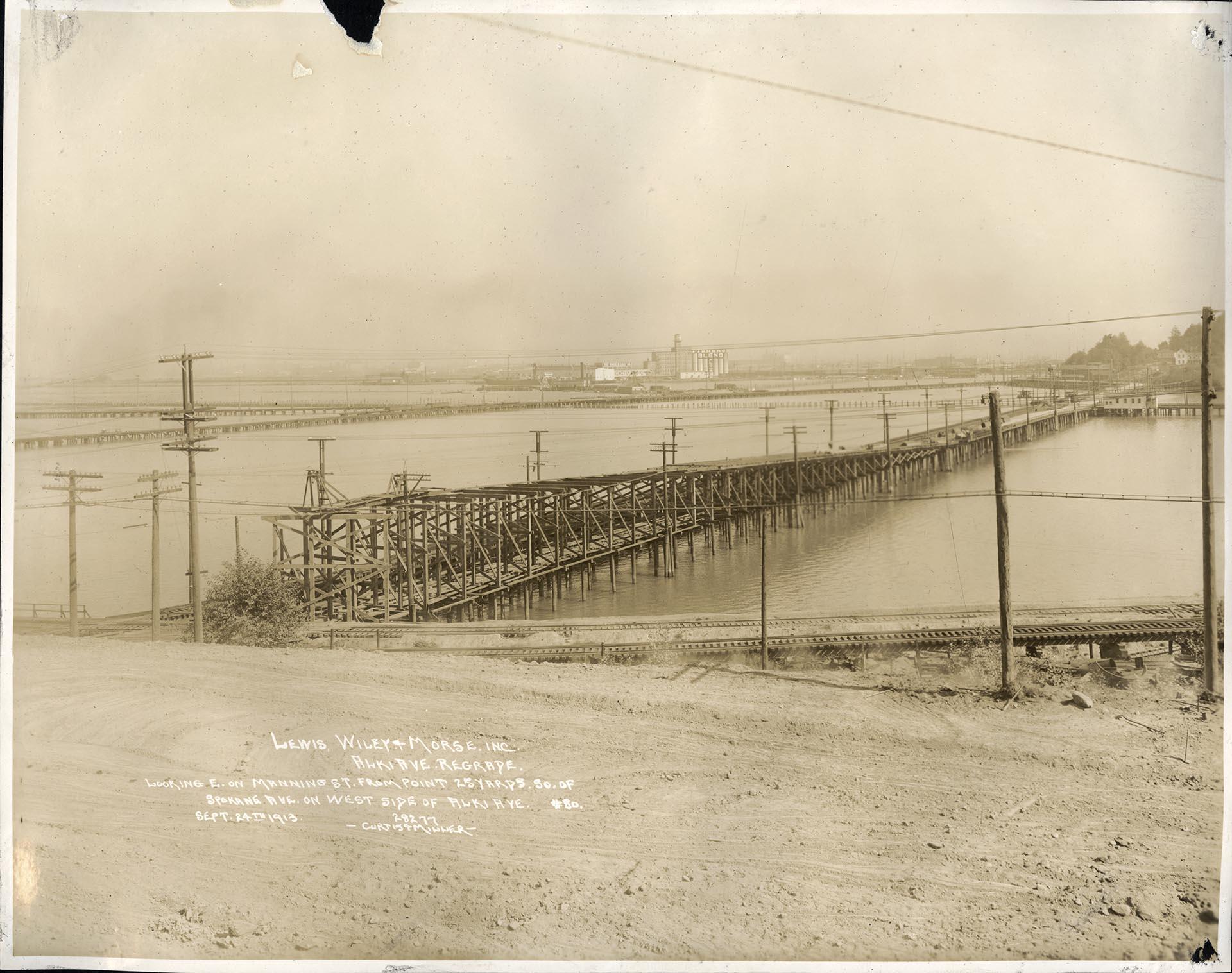 Image of Wooden bridge near Alki Avenue regrade area, West Seattle, September 24, 1913