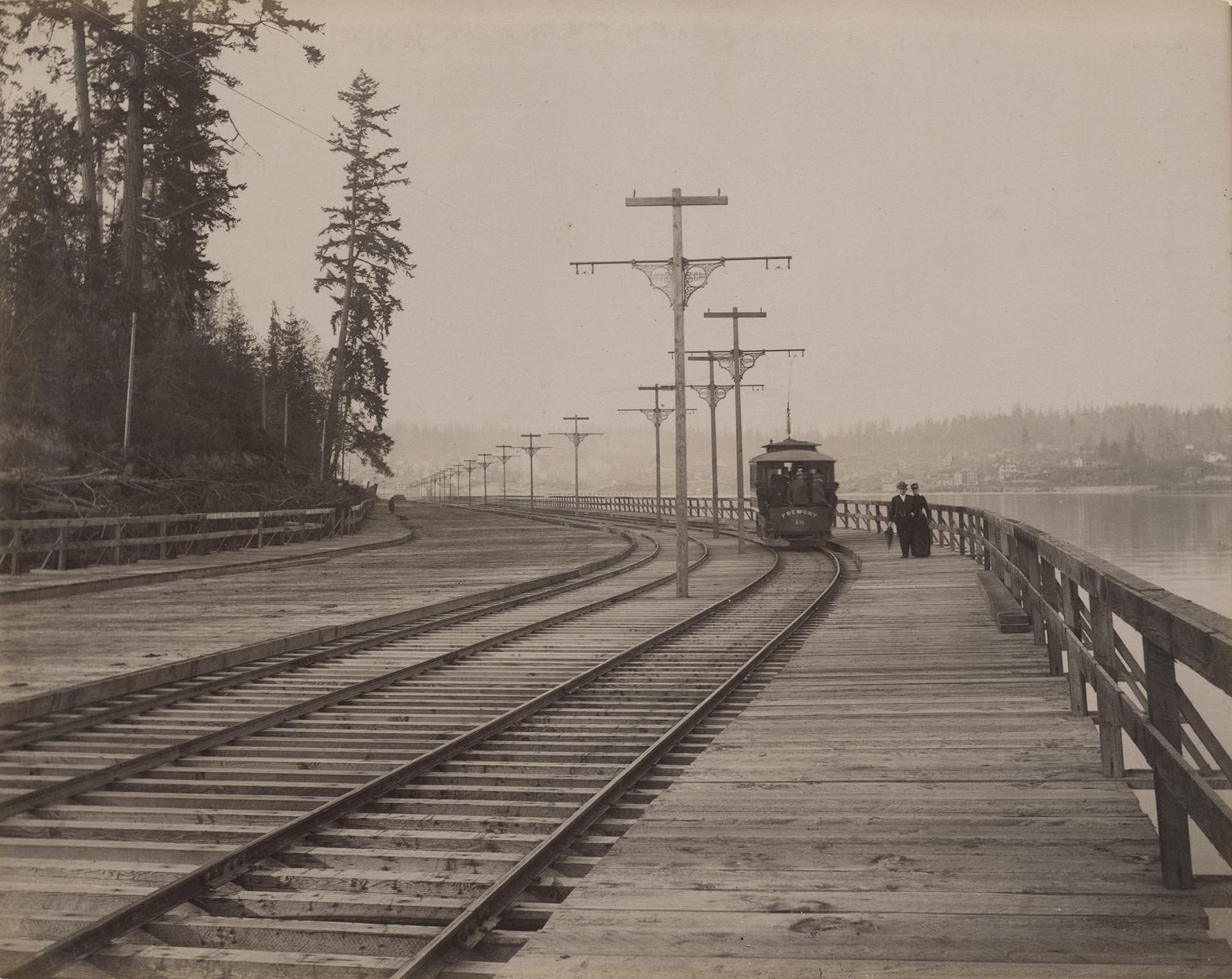 Image of Fremont streetcar and pedestrians along waterfront, Seattle, circa 1900
