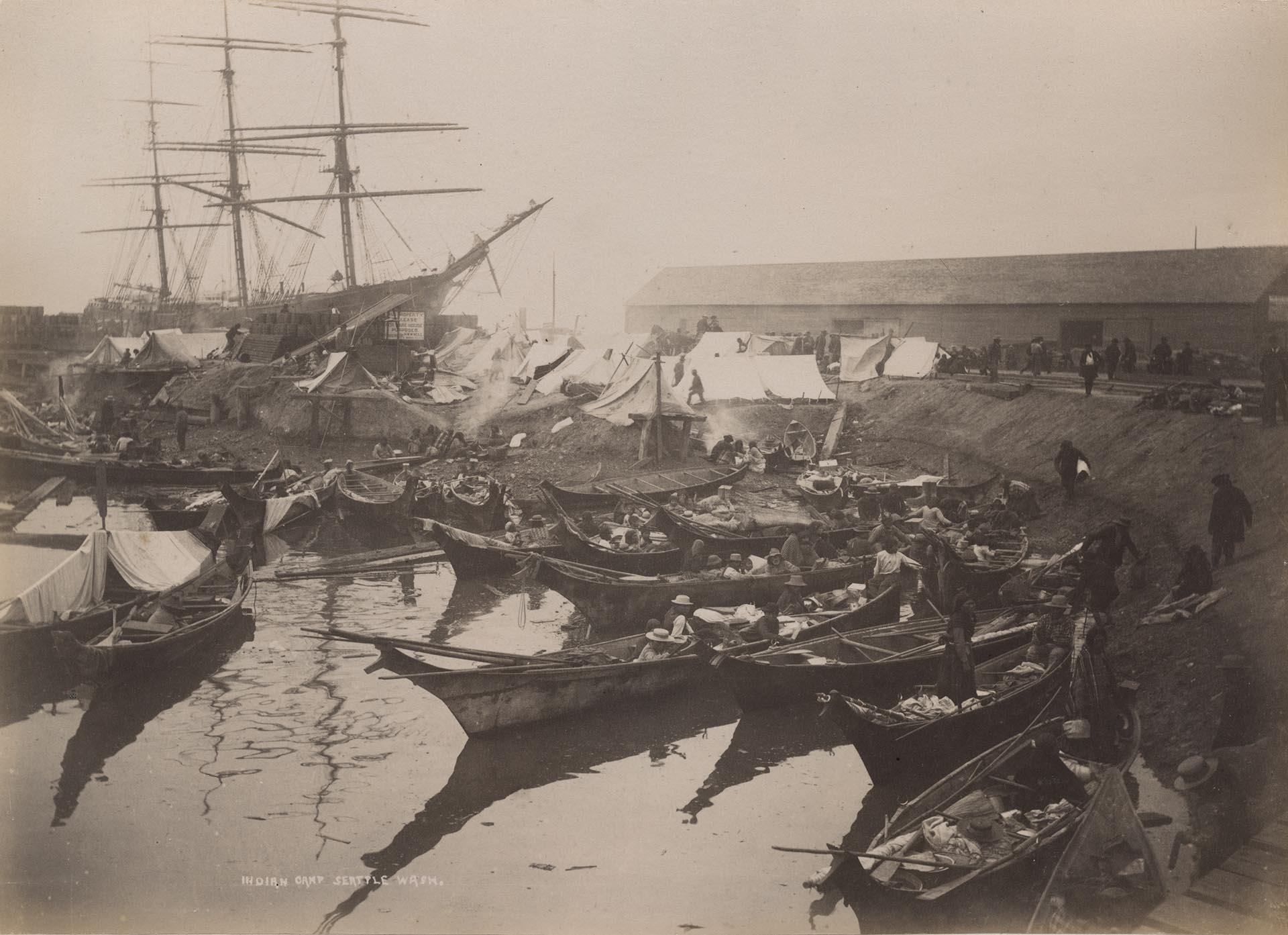 Image of Native American camp with canoes, Ballast Island, Washington Street, Seattle, circa 1890