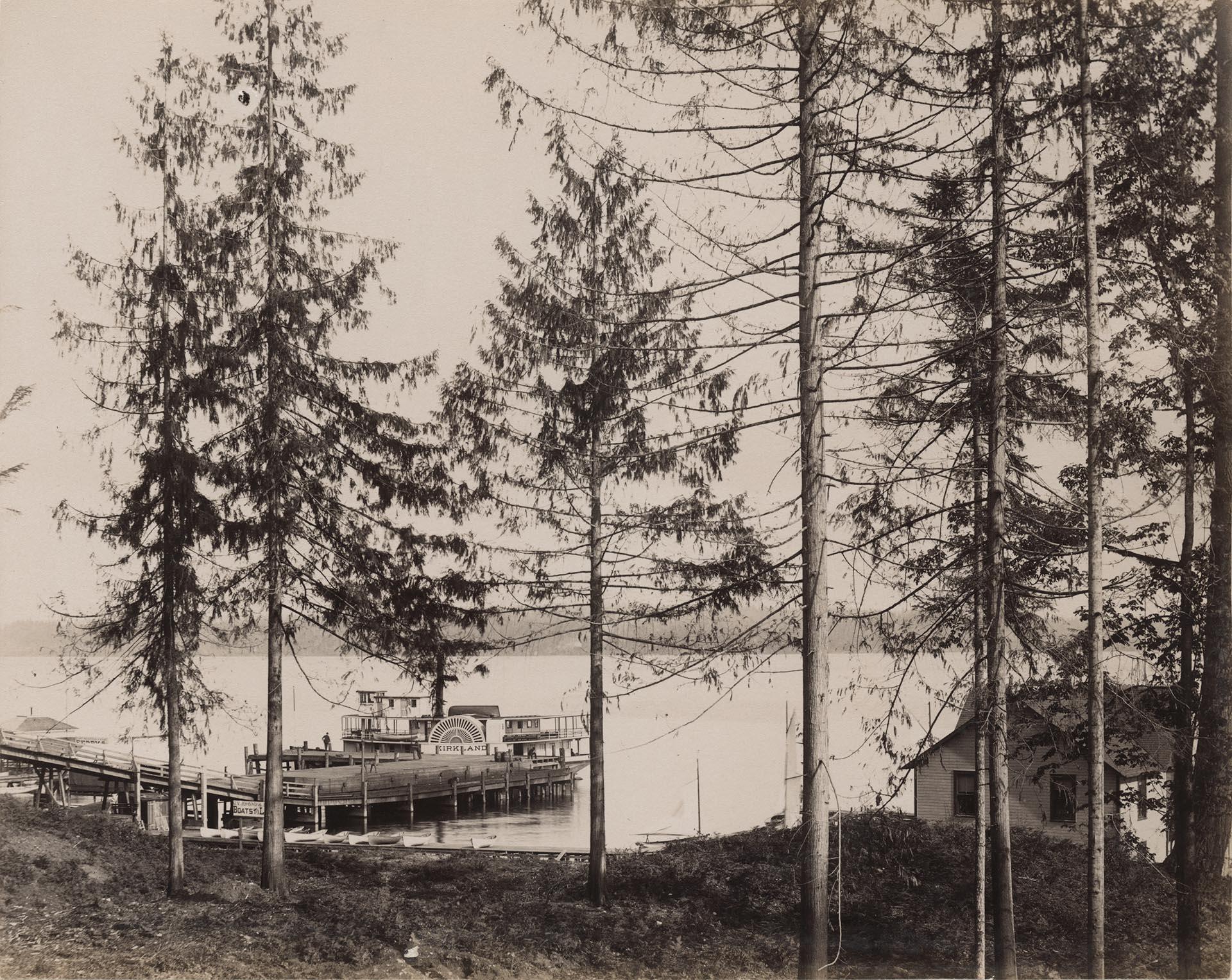 Image of Sidewheel steamboat Kirkland docked on east side of Lake Washington, circa 1890