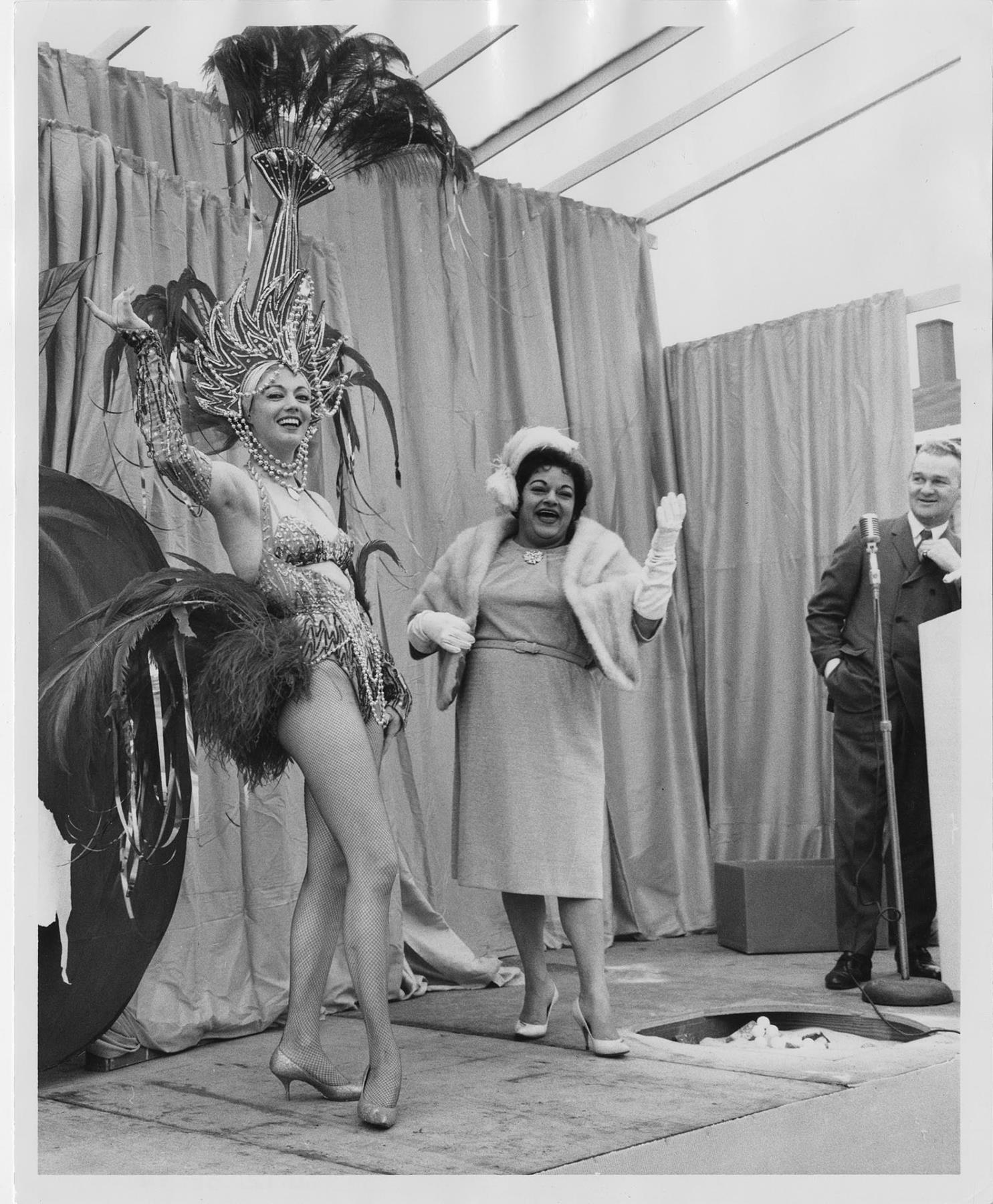 Image of Donna Rydberg, Gracie Hansen and John Eaton on stage at Century 21 groundbreaking event, 1961