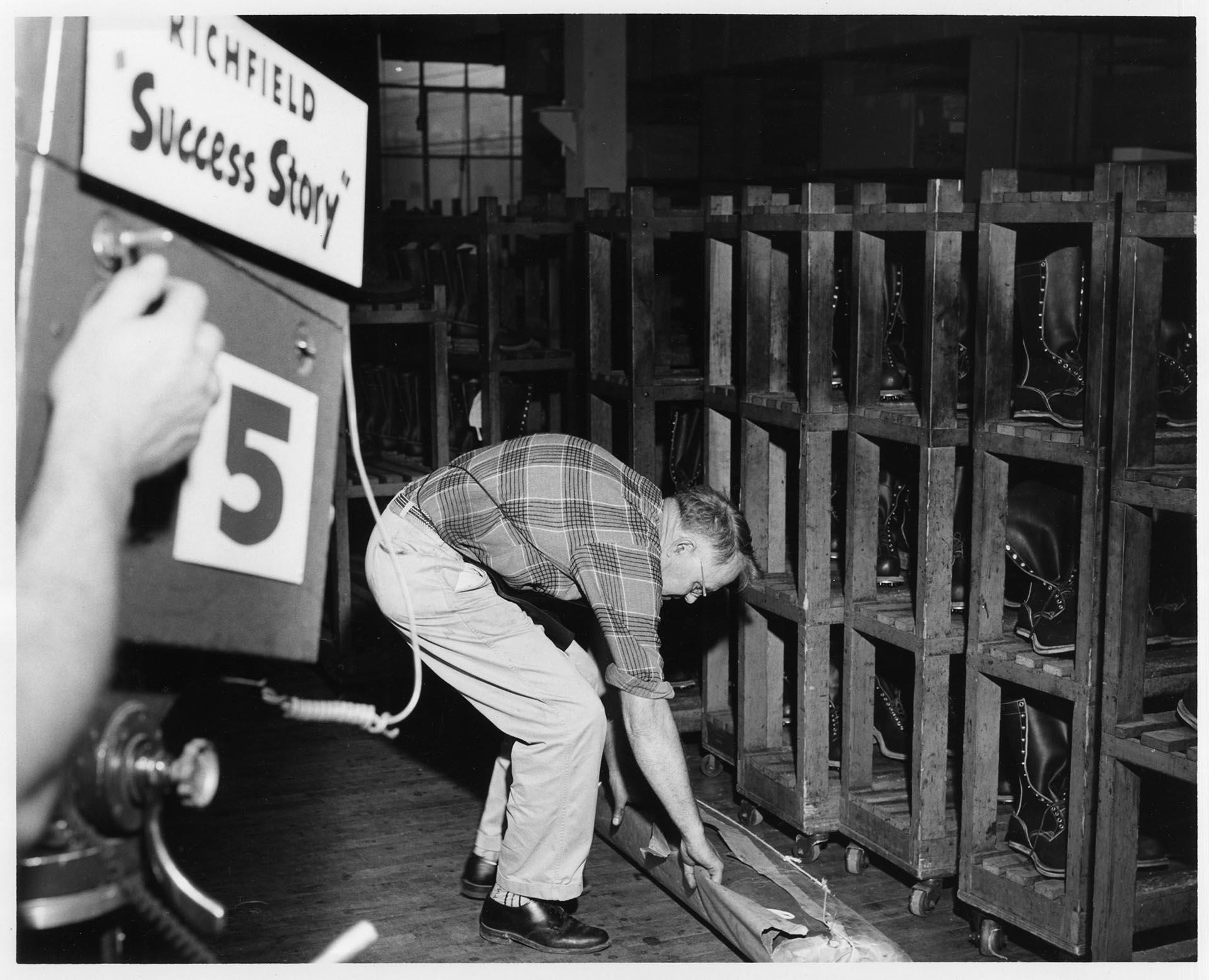 Image of Ben Peterson at work during KING-TV filming at the Currin-Greene Shoe Manufacturing Company, Seattle, 1959