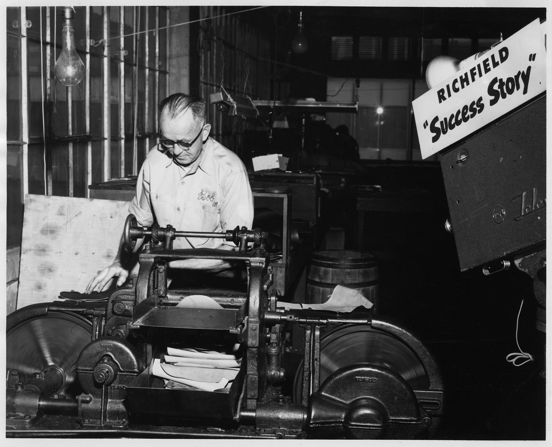 Image of Bob Burki at work during KING-TV filming at the Currin-Greene Shoe Manufacturing Company, Seattle, 1959
