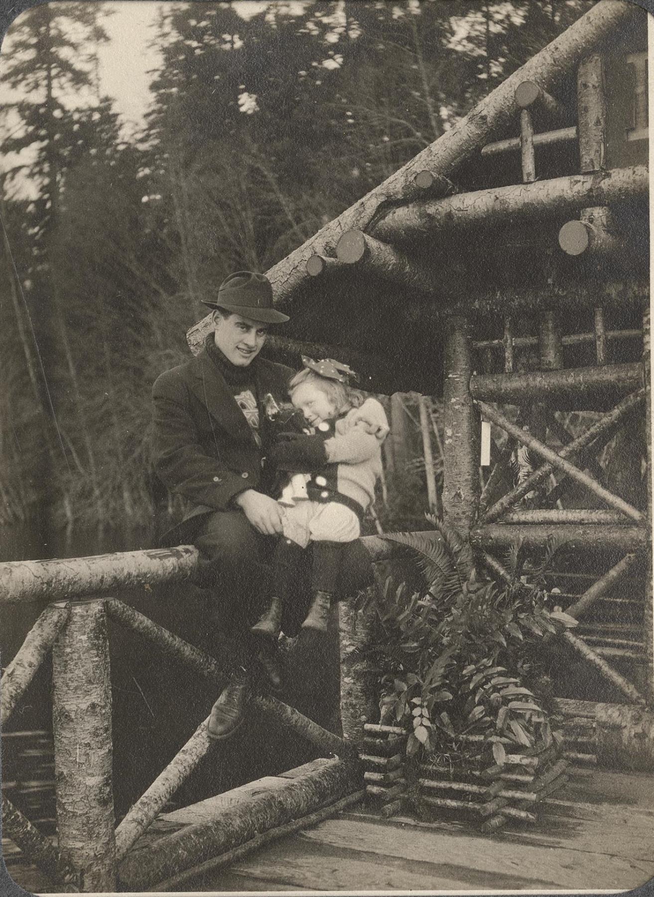Image of Man and girl posing at Beaux Arts Village, circa 1910