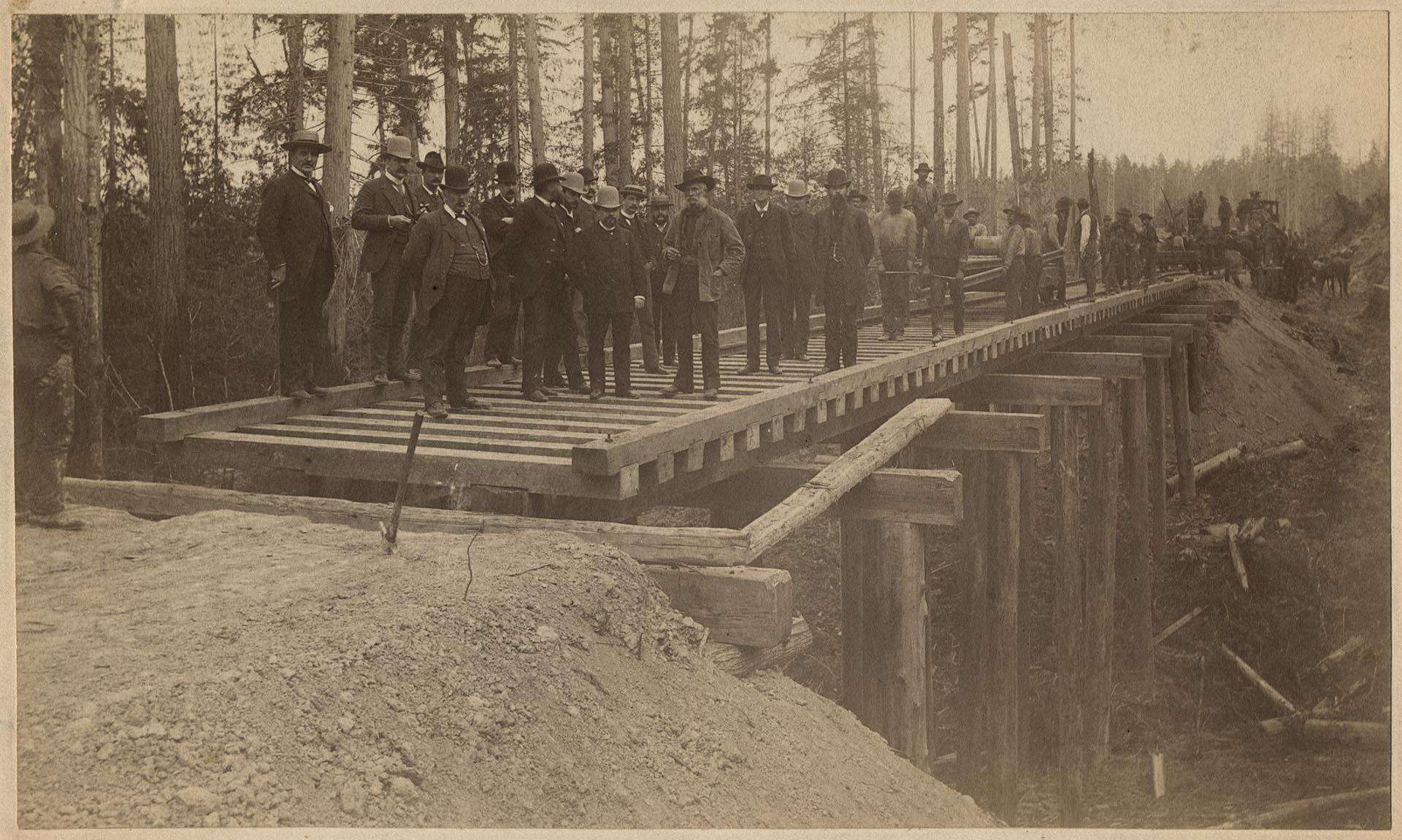 Image of Group of men on Seattle, Lake Shore & Eastern Railway line, 1887