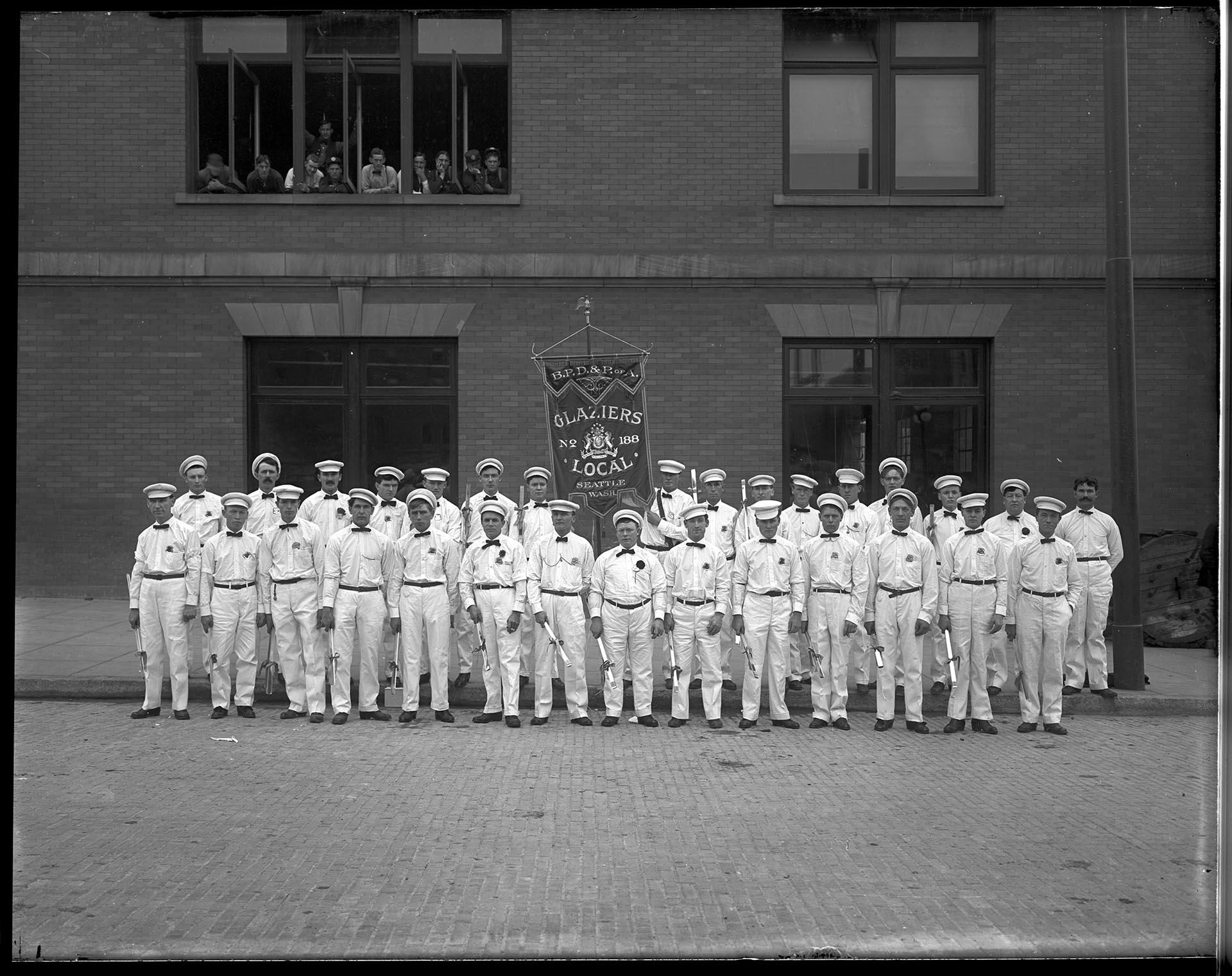 Image of Members of Glaziers Local Union No. 188 posing with banner, Seattle, circa 1900
