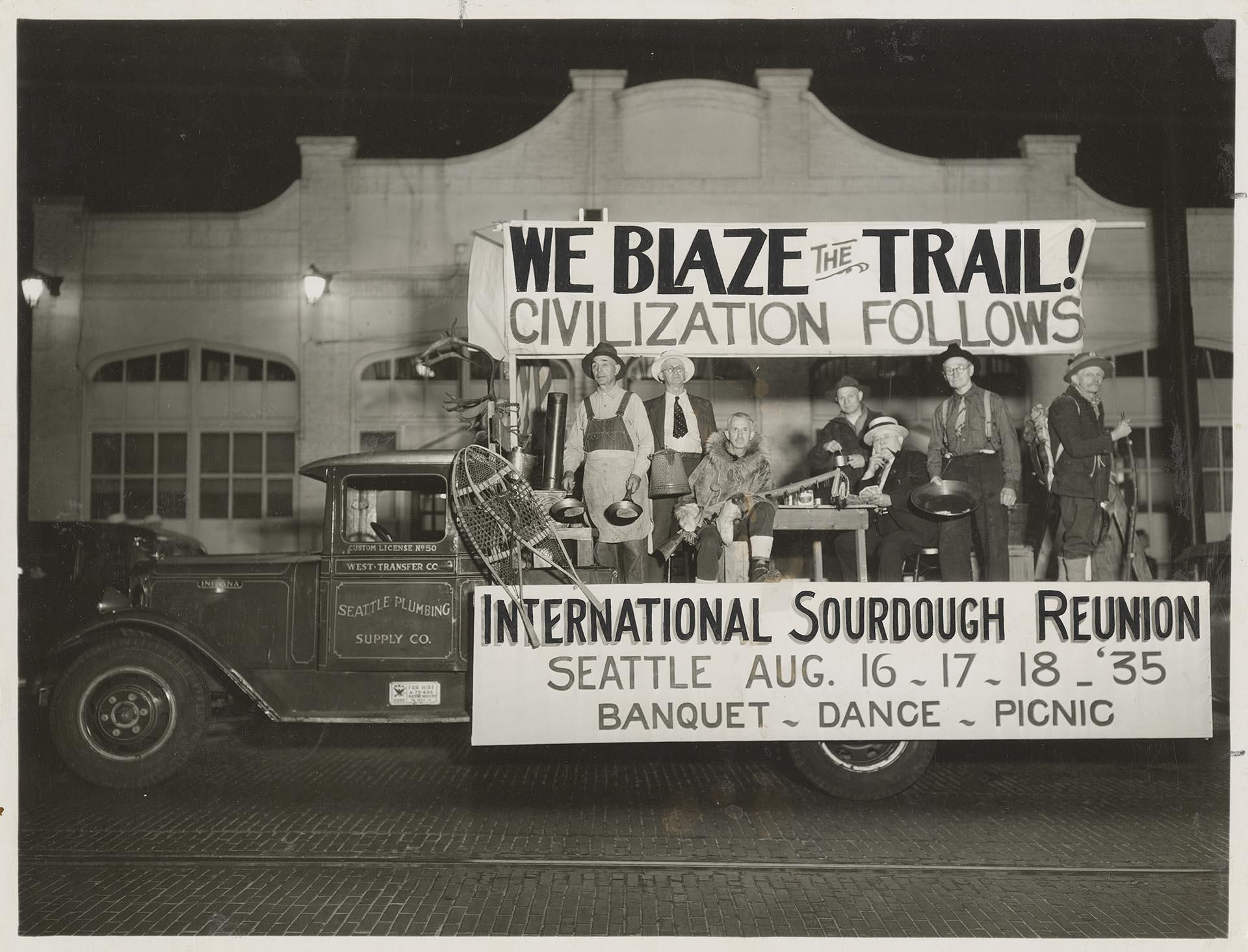 Image of Sourdoughs posing on truck at reunion, Seattle, August 1935
