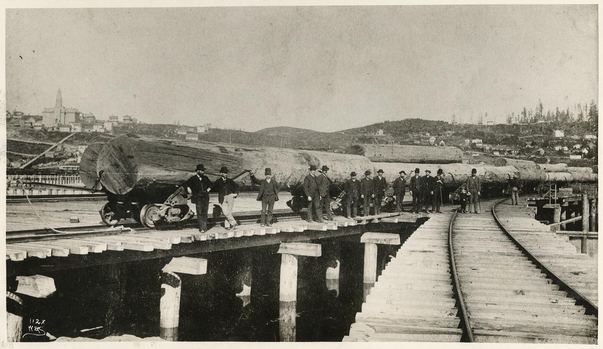 Image of Arrival of the first log shipment via the Columbia & Puget Sound Railroad, Seattle, 1880
