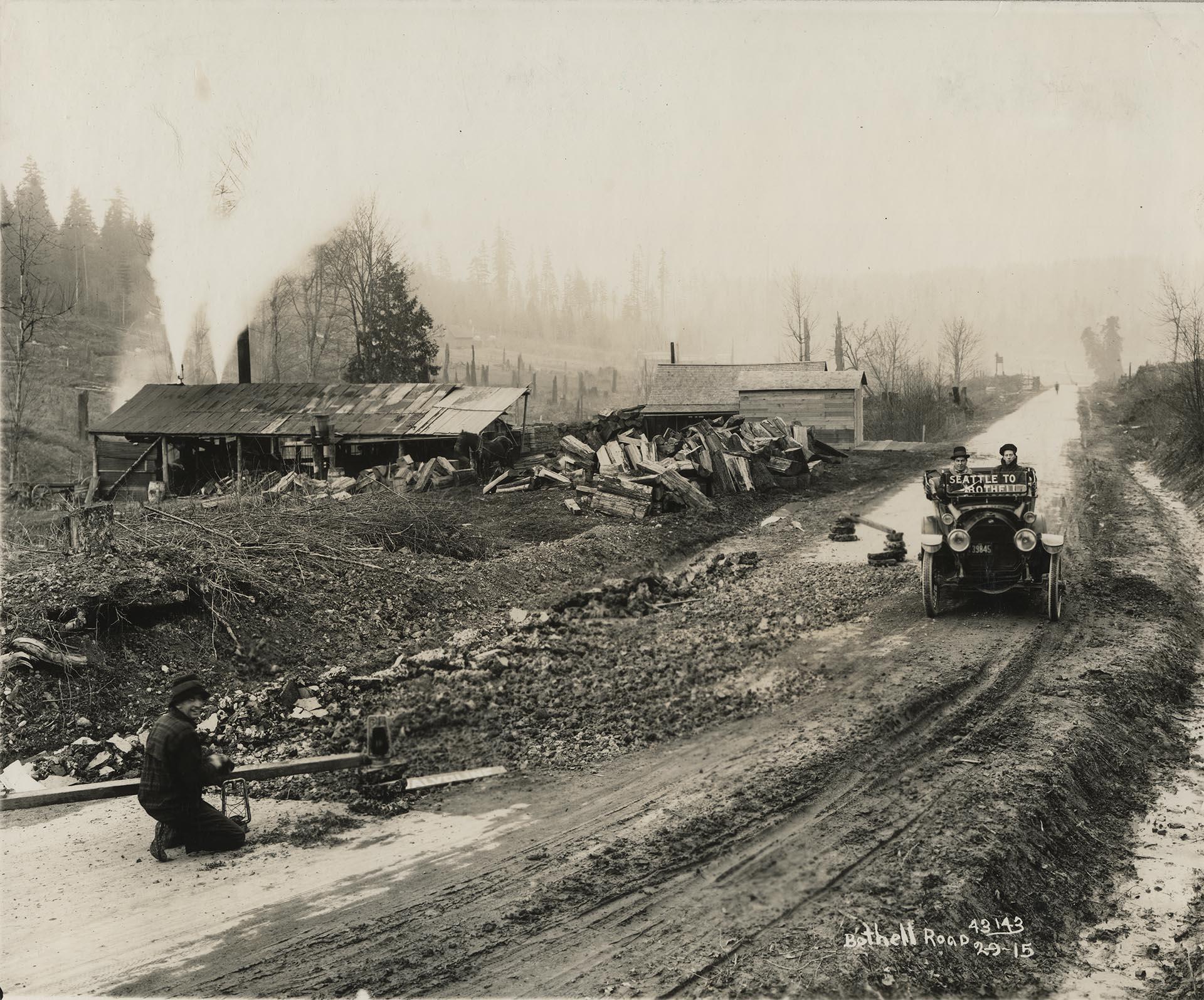 Image of Car driving on Seattle to Bothell road, February 9, 1915