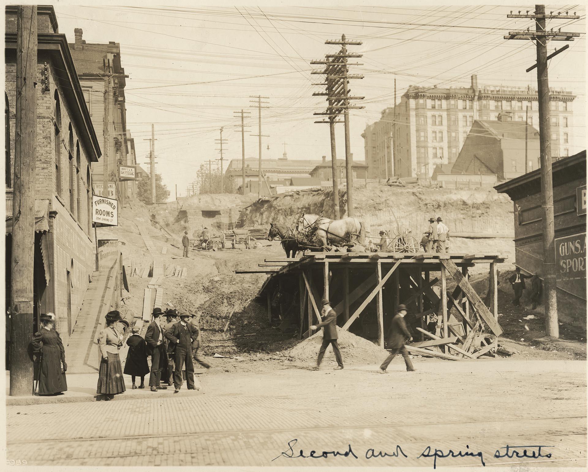Image of Second Ave. and Spring St. during regrade, circa 1909