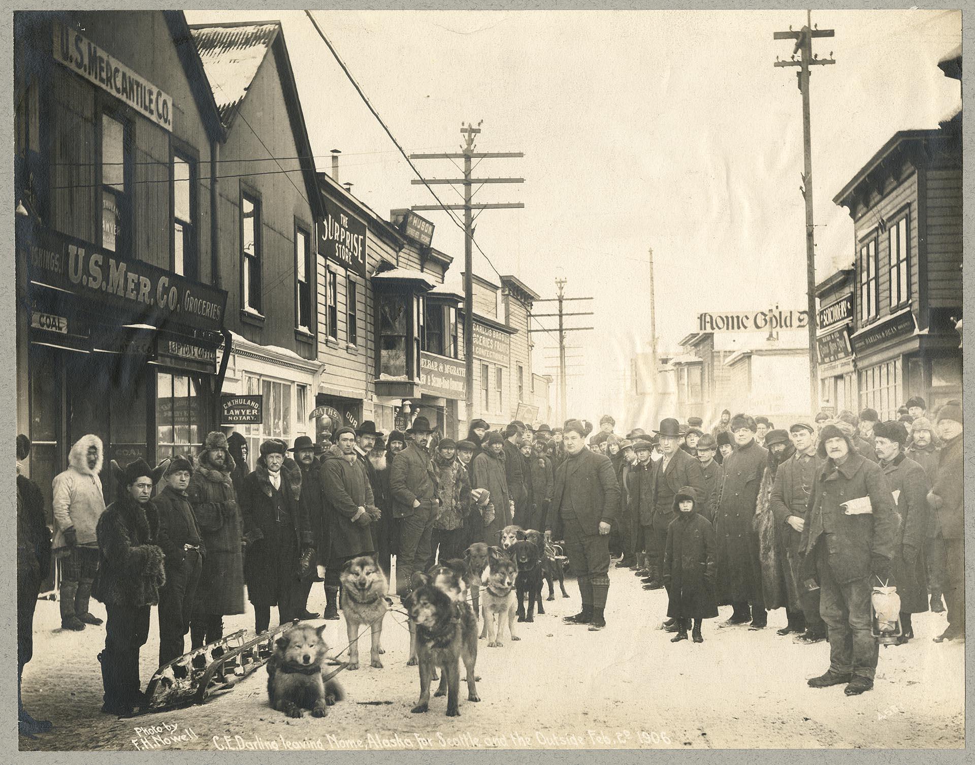 Image of Ned Darling posing with dog sled team before departure for Seattle, Nome, Alaska, February 2, 1906