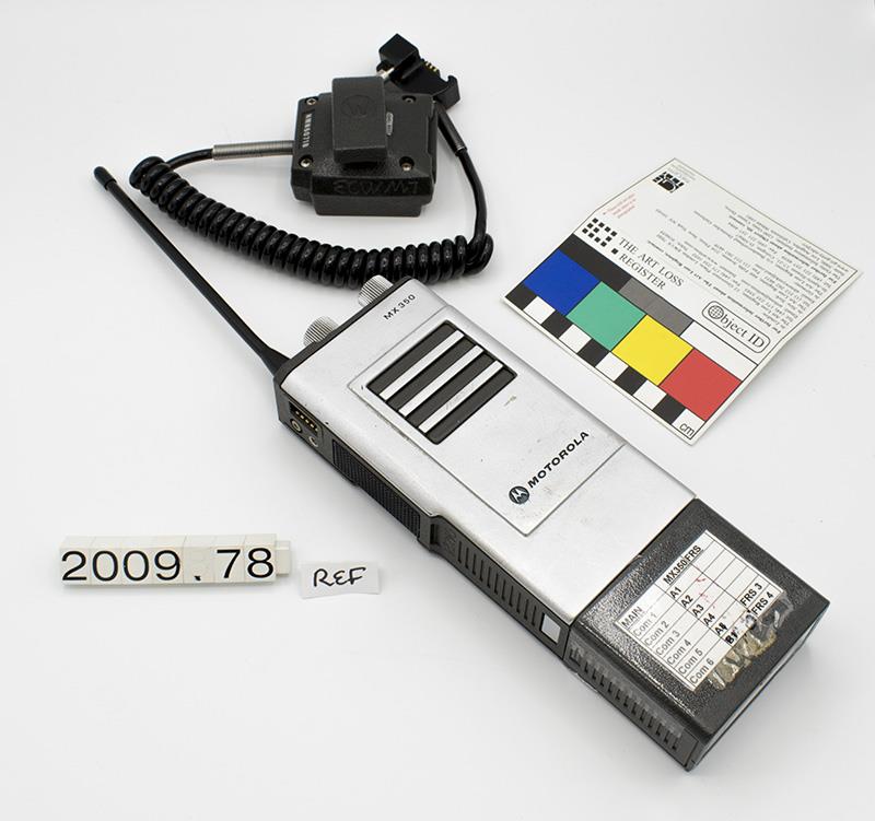Image of One of two Motorola handheld radios, used by Direct Action Network during the WTO protests, 1999
