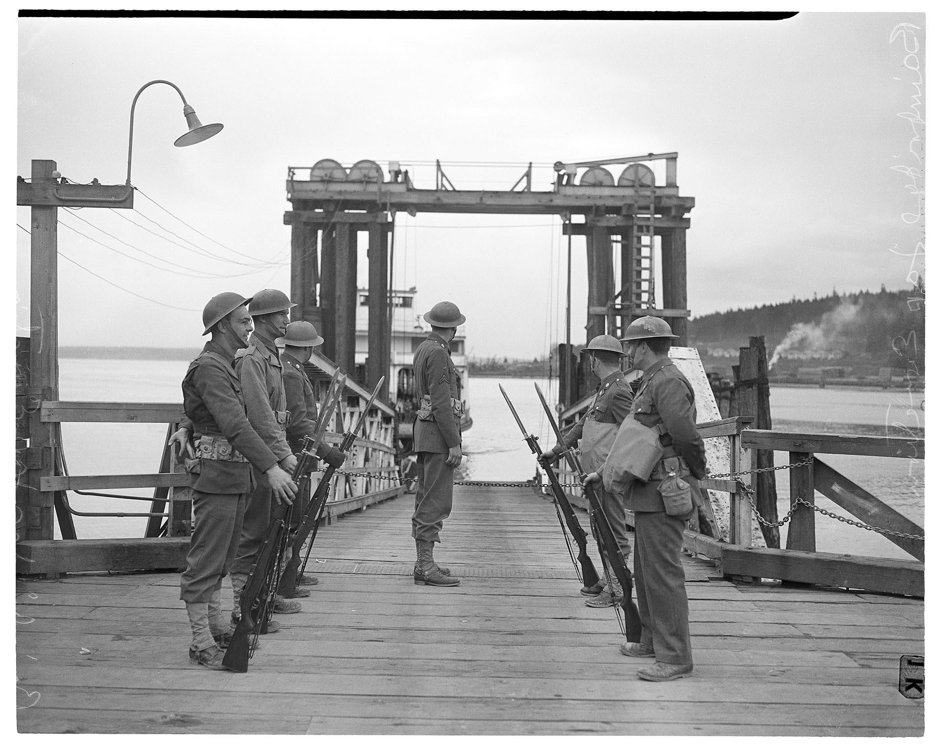 Image of U. S. Army sentries at Winslow ferry dock, Bainbridge Island, March 25, 1942