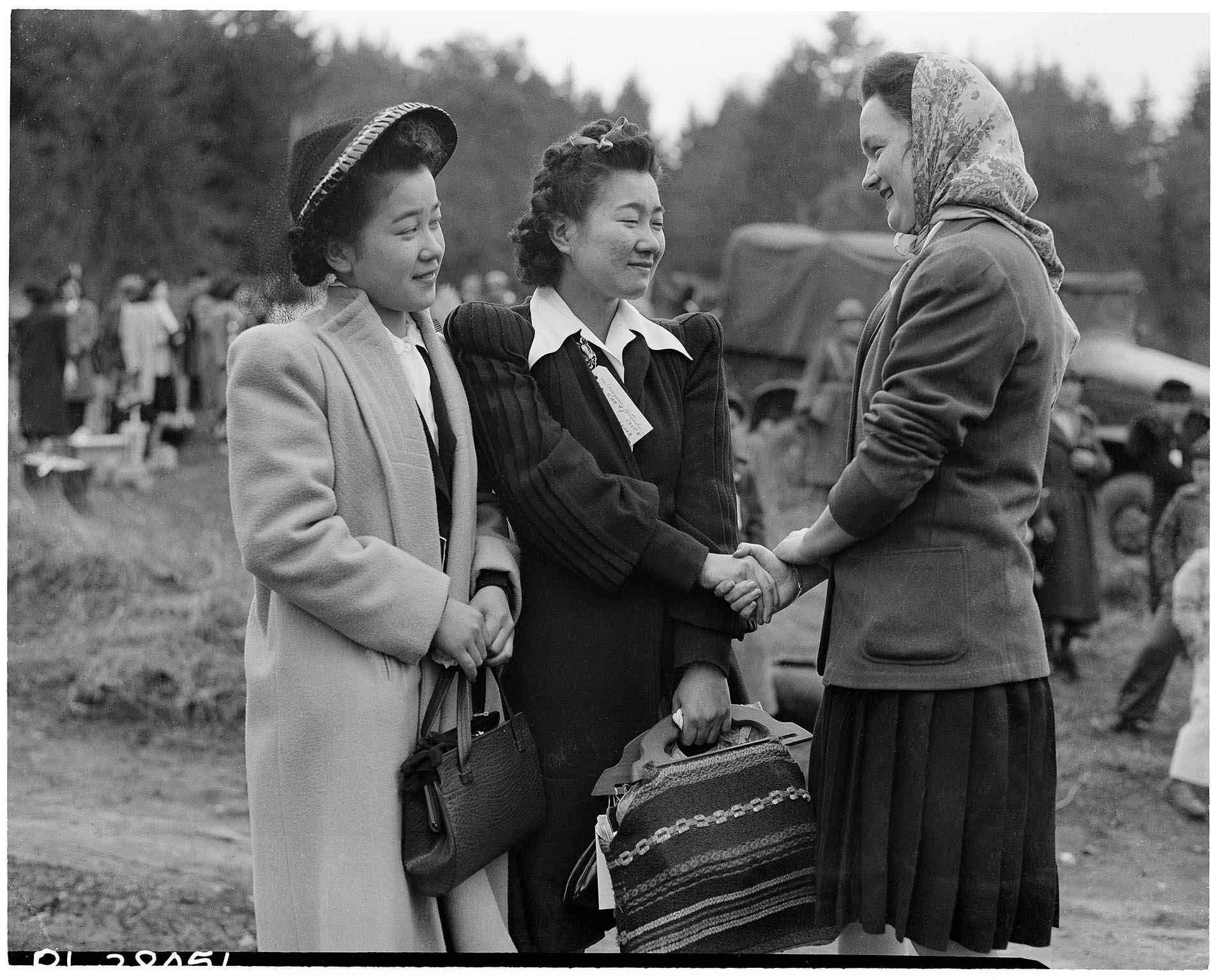 Image of Japanese American women saying goodbye to friend during forced removal, Bainbridge Island, March 30, 1942