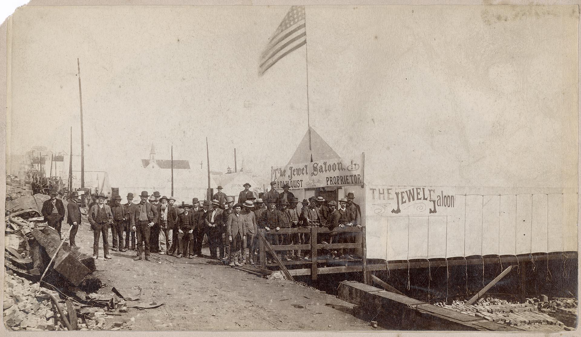Image of Men posing outside Jewel Saloon after Great Seattle Fire, June 1889