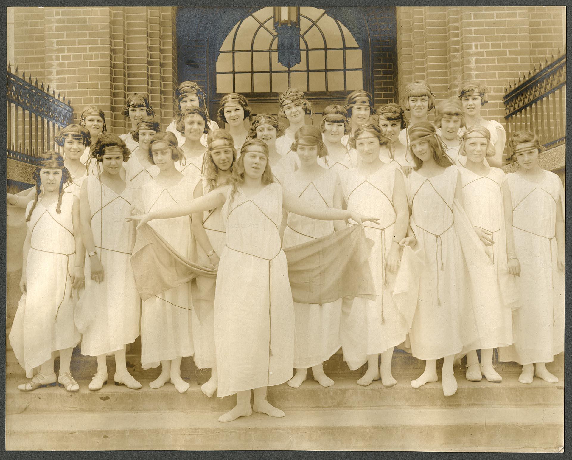 Image of Eighth grade girls in Greek costume on steps of Madrona School, Seattle, 1923
