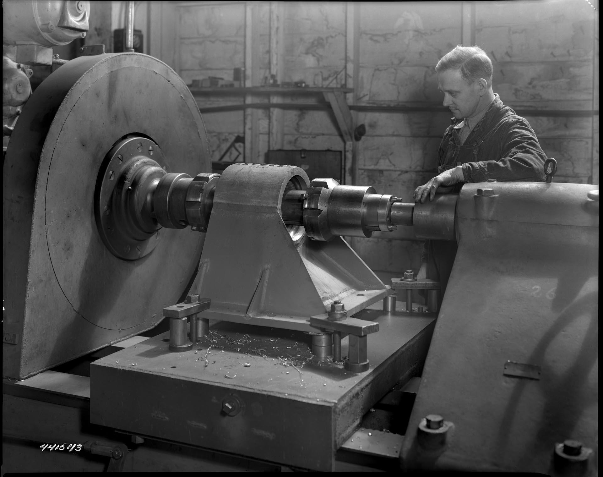 Image of Berger Engineering Works employee with machinery, Seattle, circa 1944