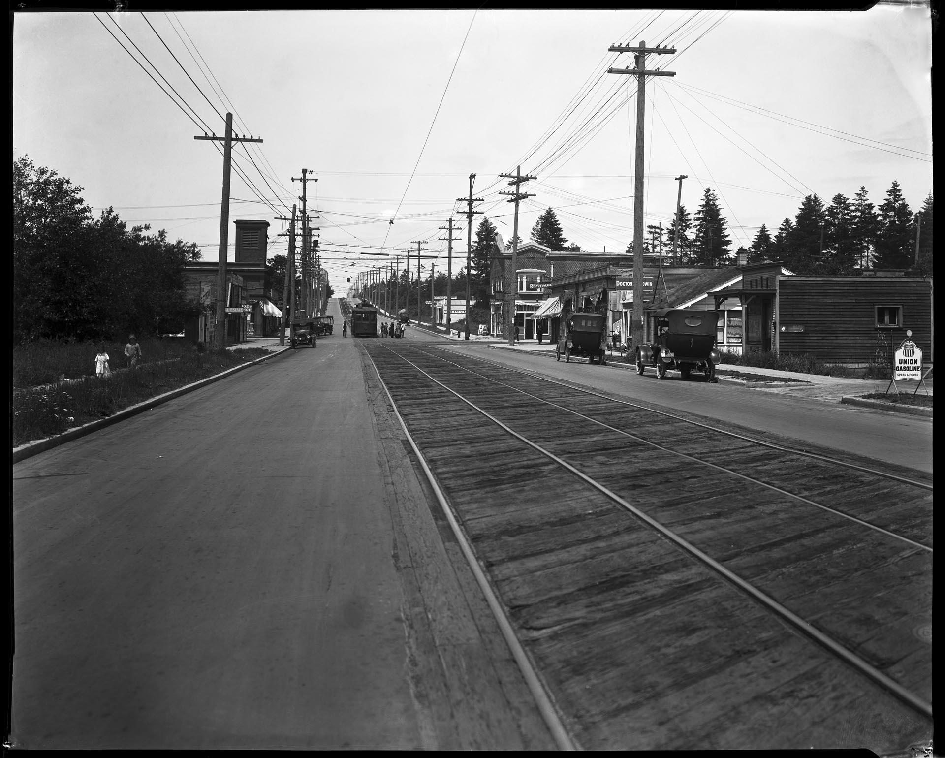 Image of Passengers boarding trolley at West Seattle Junction,  circa 1925