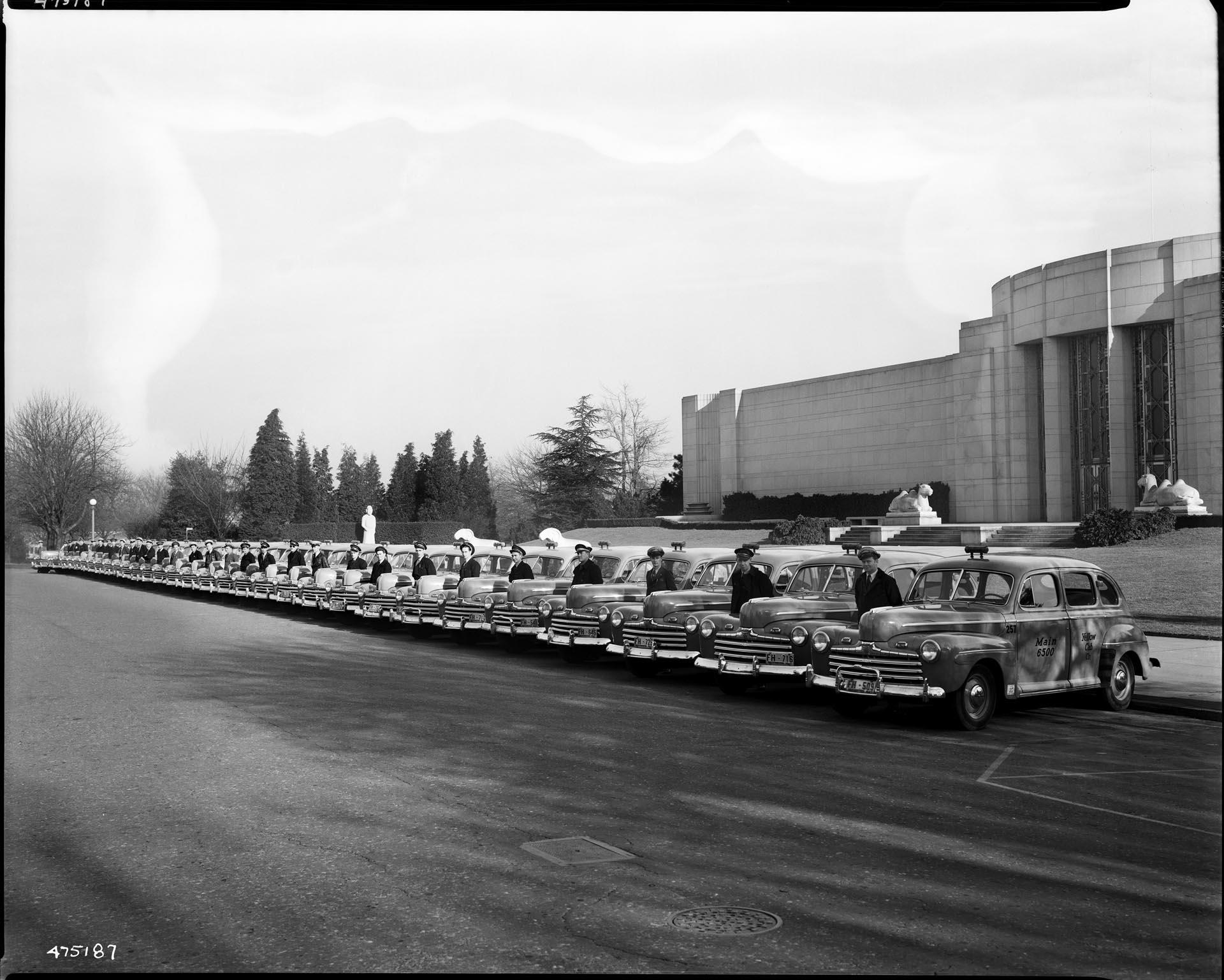 Image of Yellow cabs drivers posing in Volunteer Park, Seattle, 1947