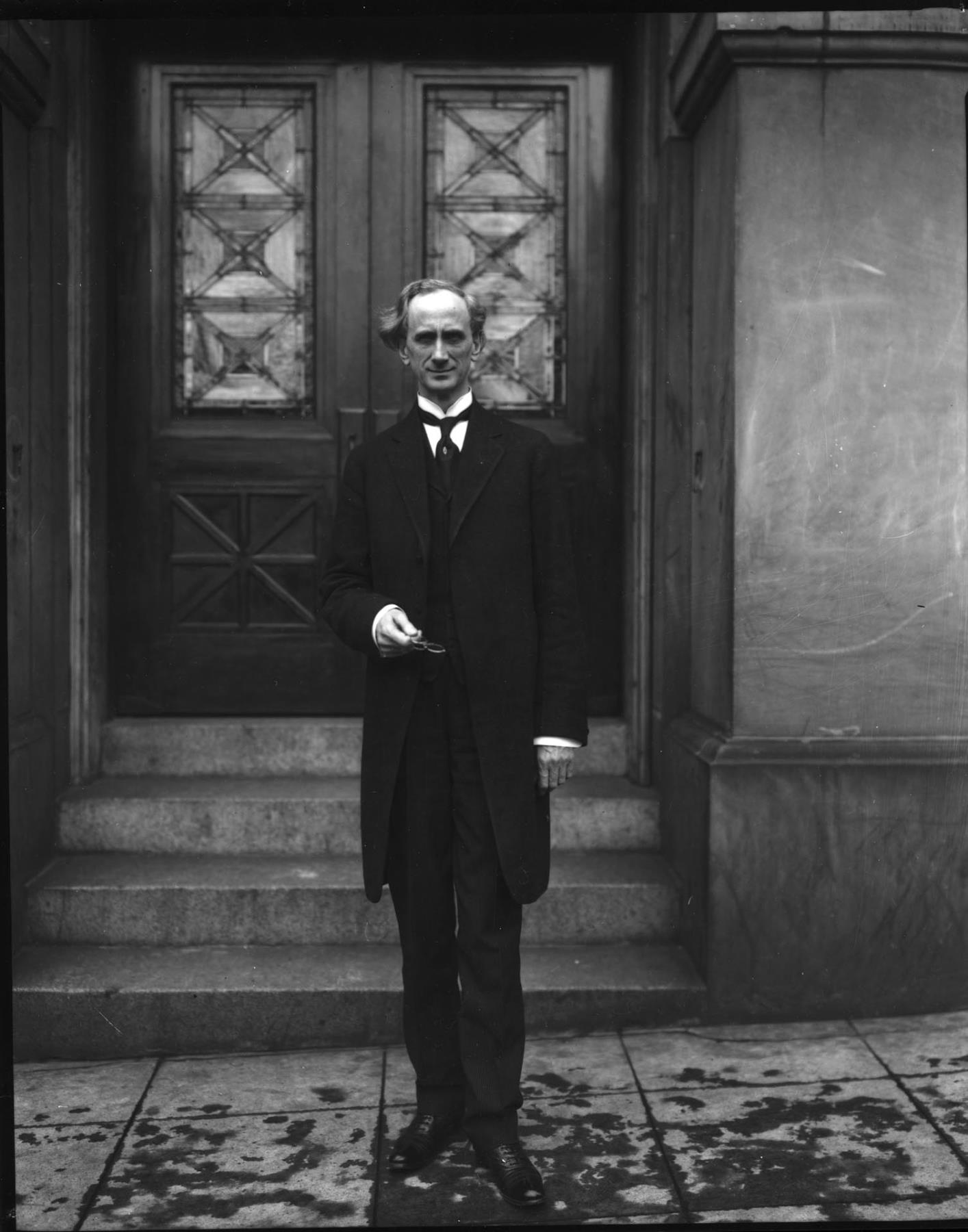 Image of Rev. Mark Matthews posing on sidewalk, Seattle, circa 1910
