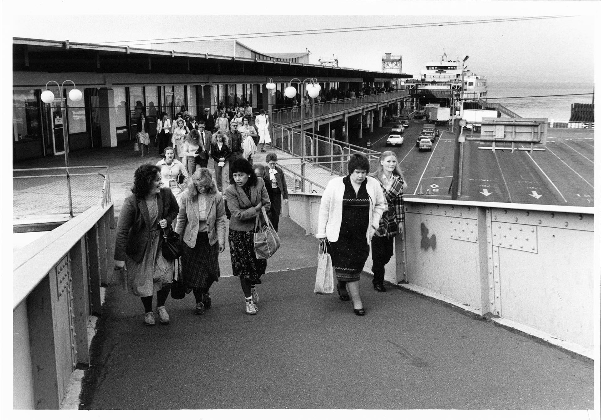 Image of Ferry commuters arriving in Seattle, September 23, 1983