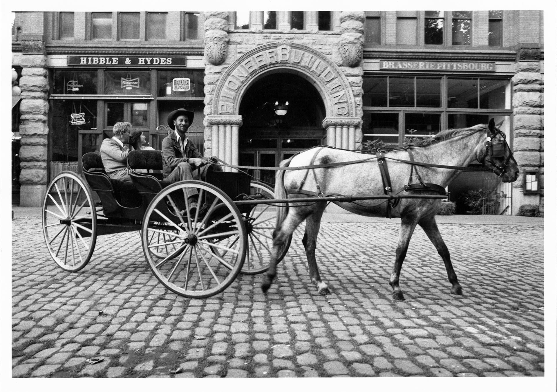 Image of Driver posing with horse and carriage, Seattle, September 23, 1983