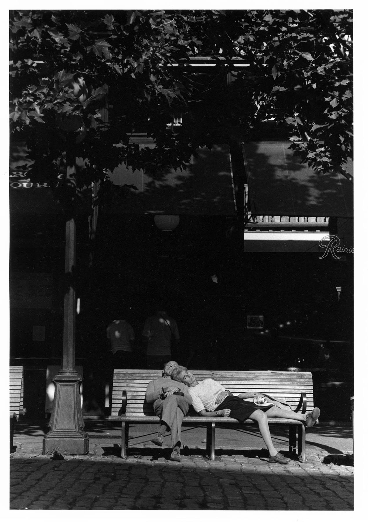 Image of Couple sleeping on bench, September 23, 1983