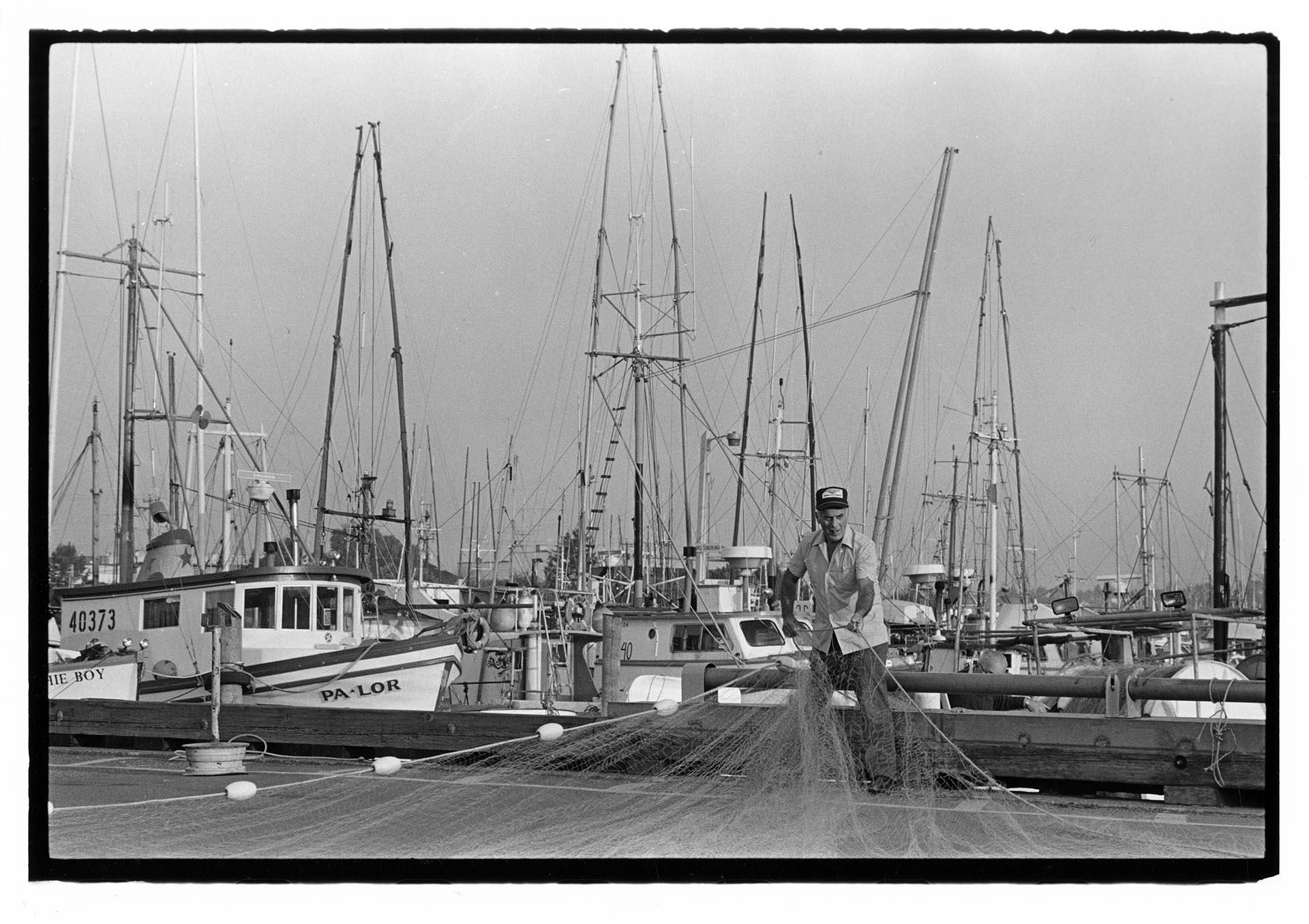 Image of Fisherman fixing net, Seattle,  September 23, 1983