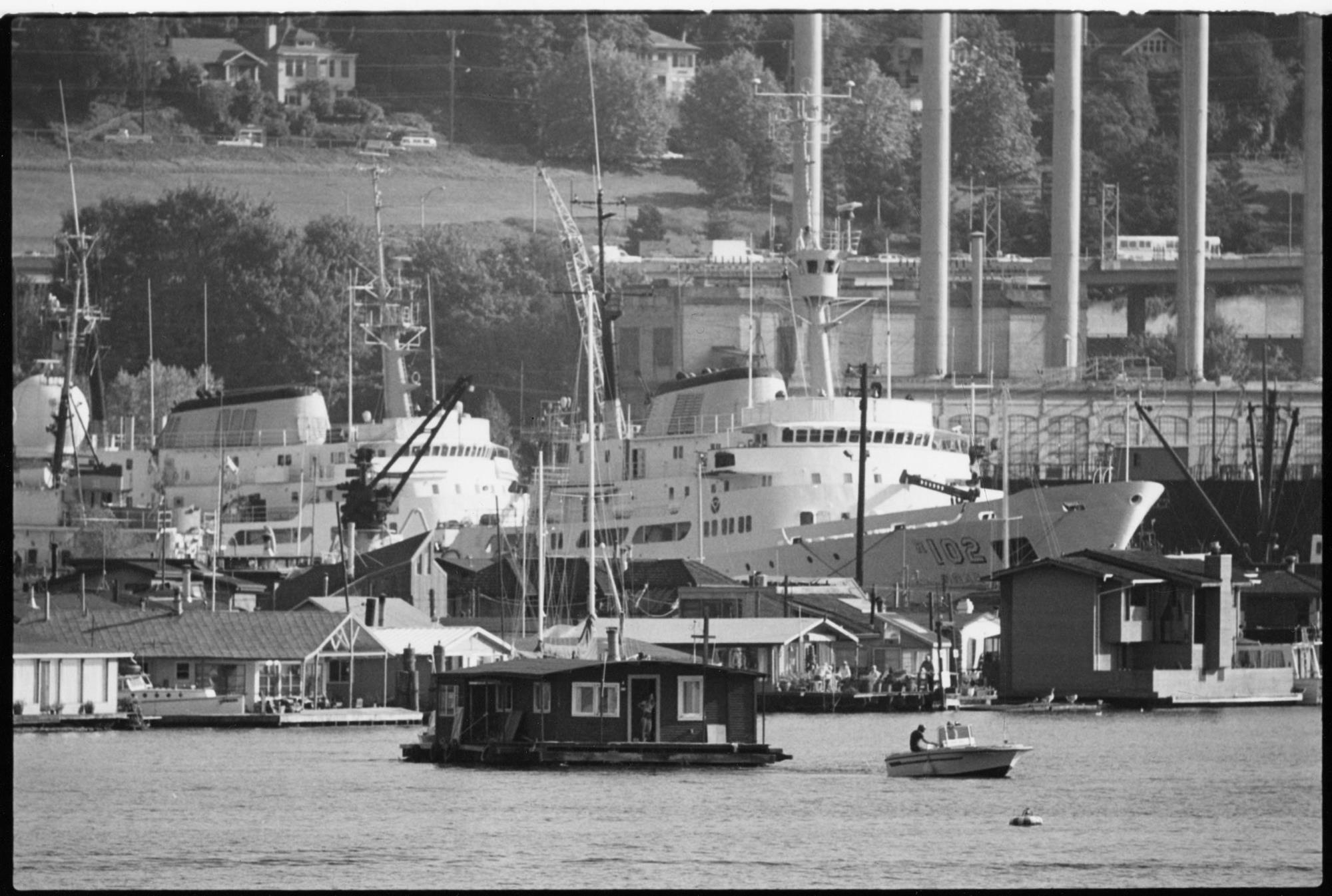 Image of Towing a houseboat across Lake Union, Seattle, September 23, 1983