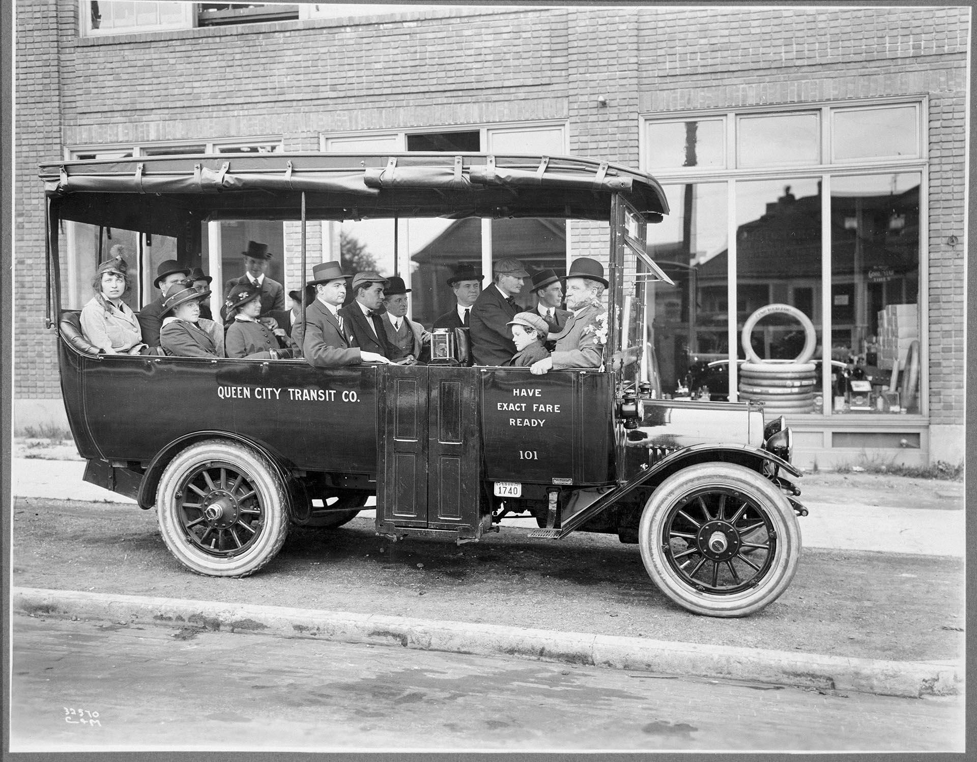Image of Michael Carzes and others sitting in a jitney, Seattle, circa 1919