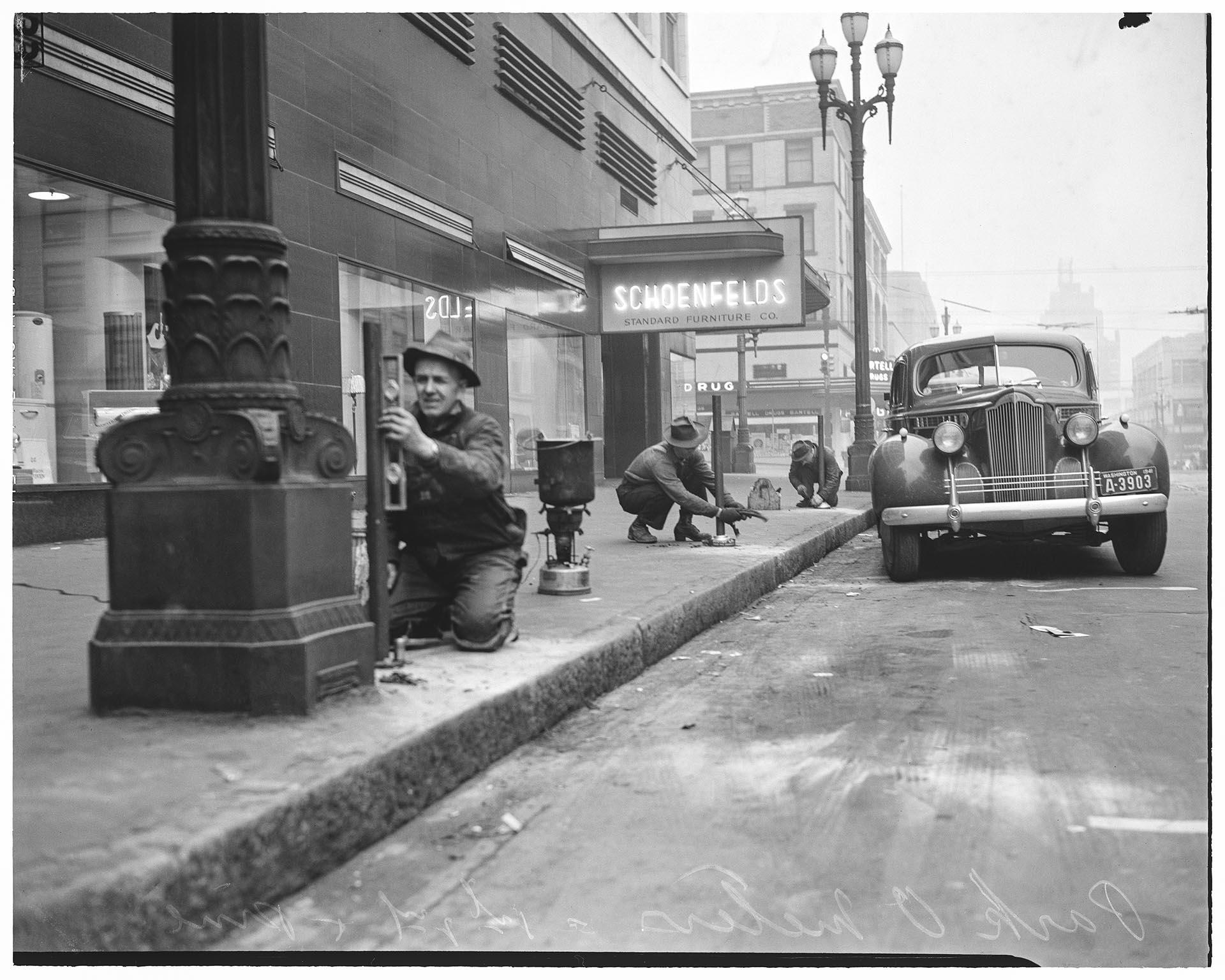 Image of City workers installing parking meters, Seattle, November 1941