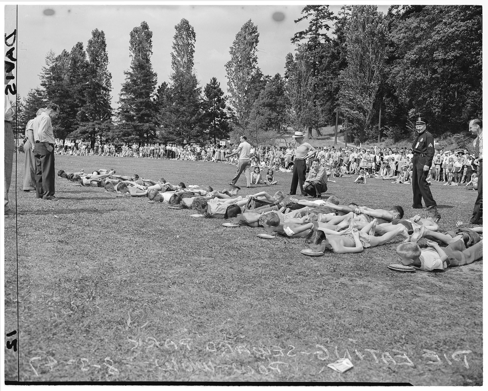 Image of Boys participating in pie eating contest, Seattle, August 3, 1947