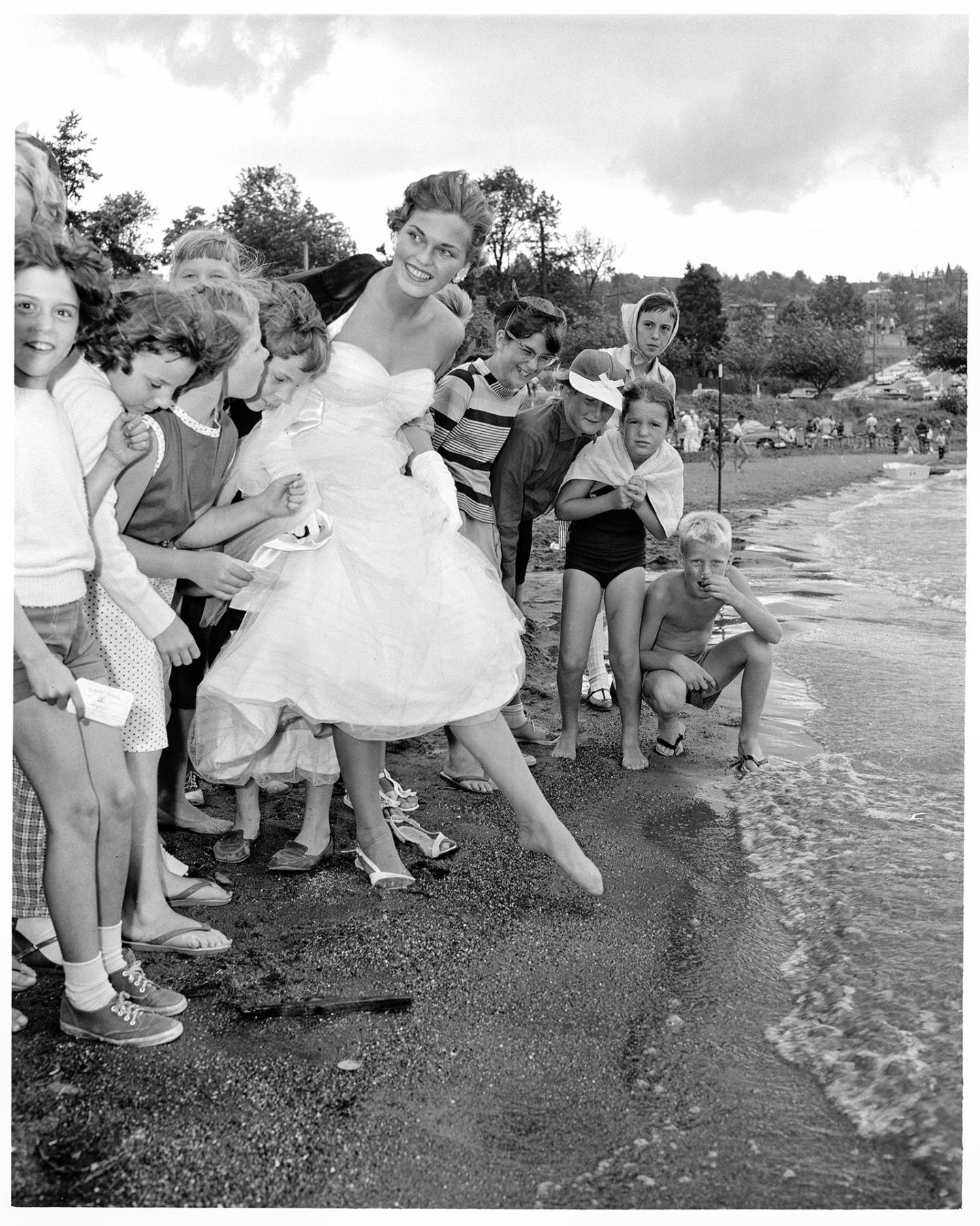 Image of Pageant queen and children on beach, Seattle, August 3, 1958