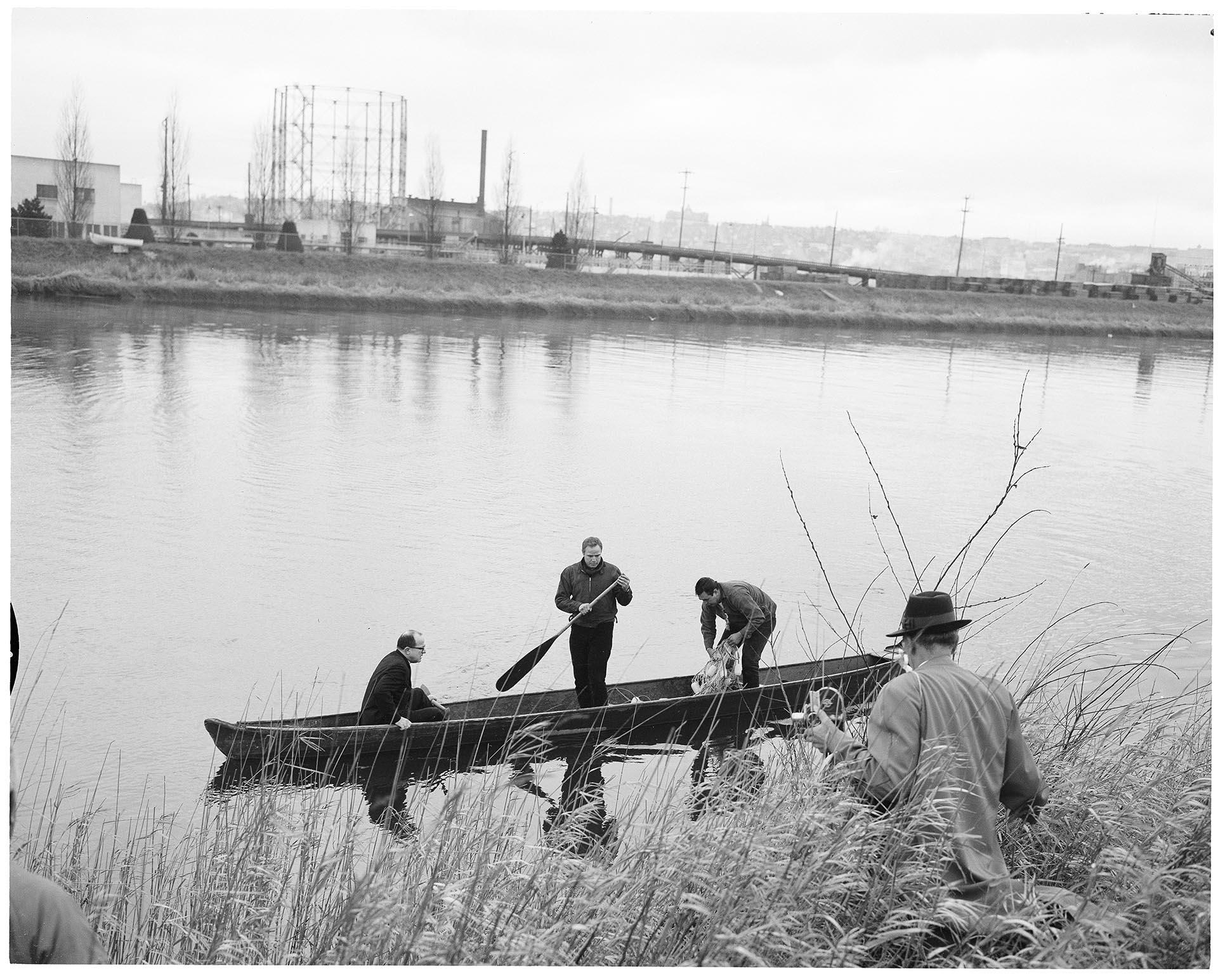 Image of John Yaryan, Marlon Brando, and Bob Satiacum on Puyallup River, March 2, 1964