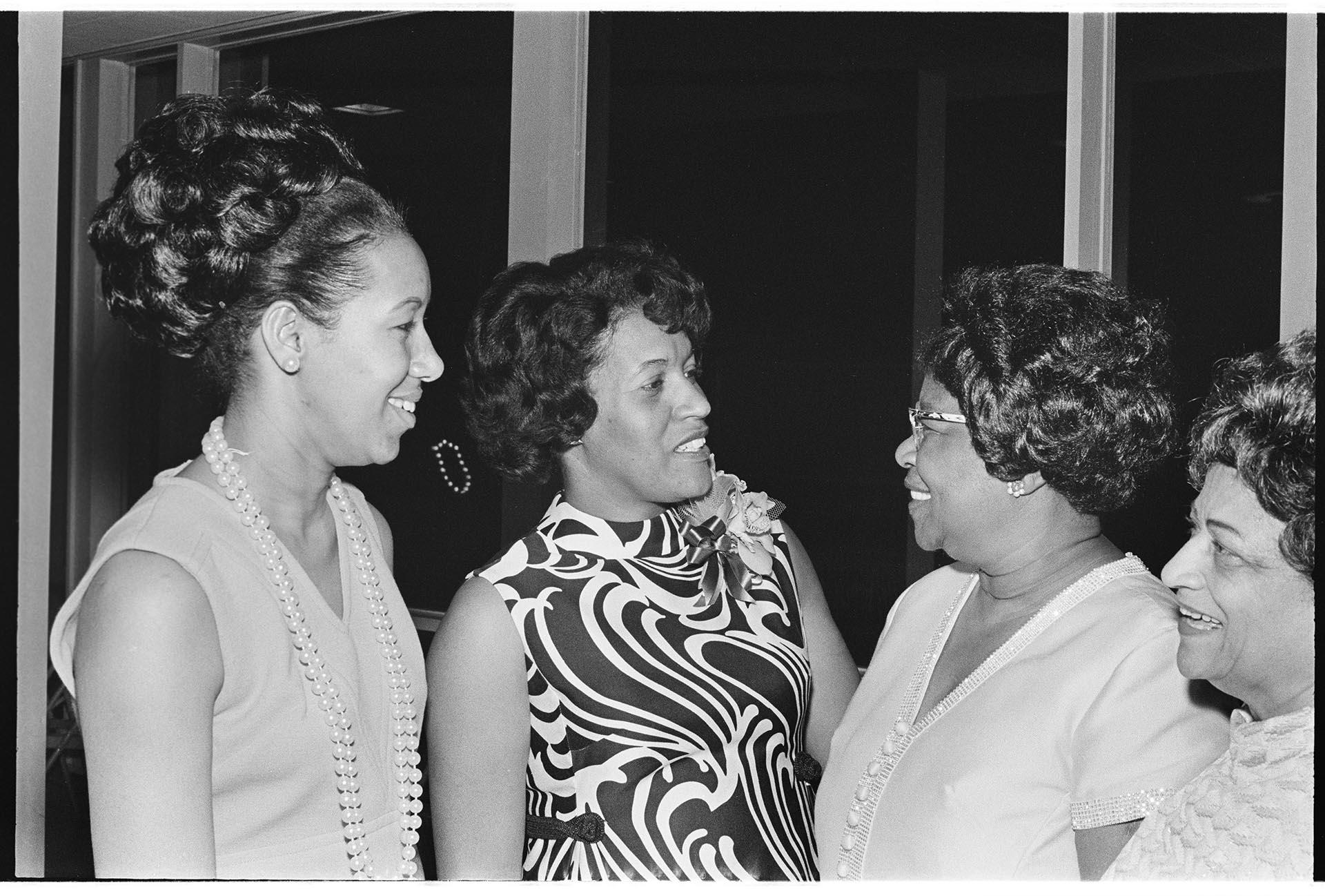 Image of Myrlie Evers-Williams talking with reception attendees, Seattle, April 25, 1970