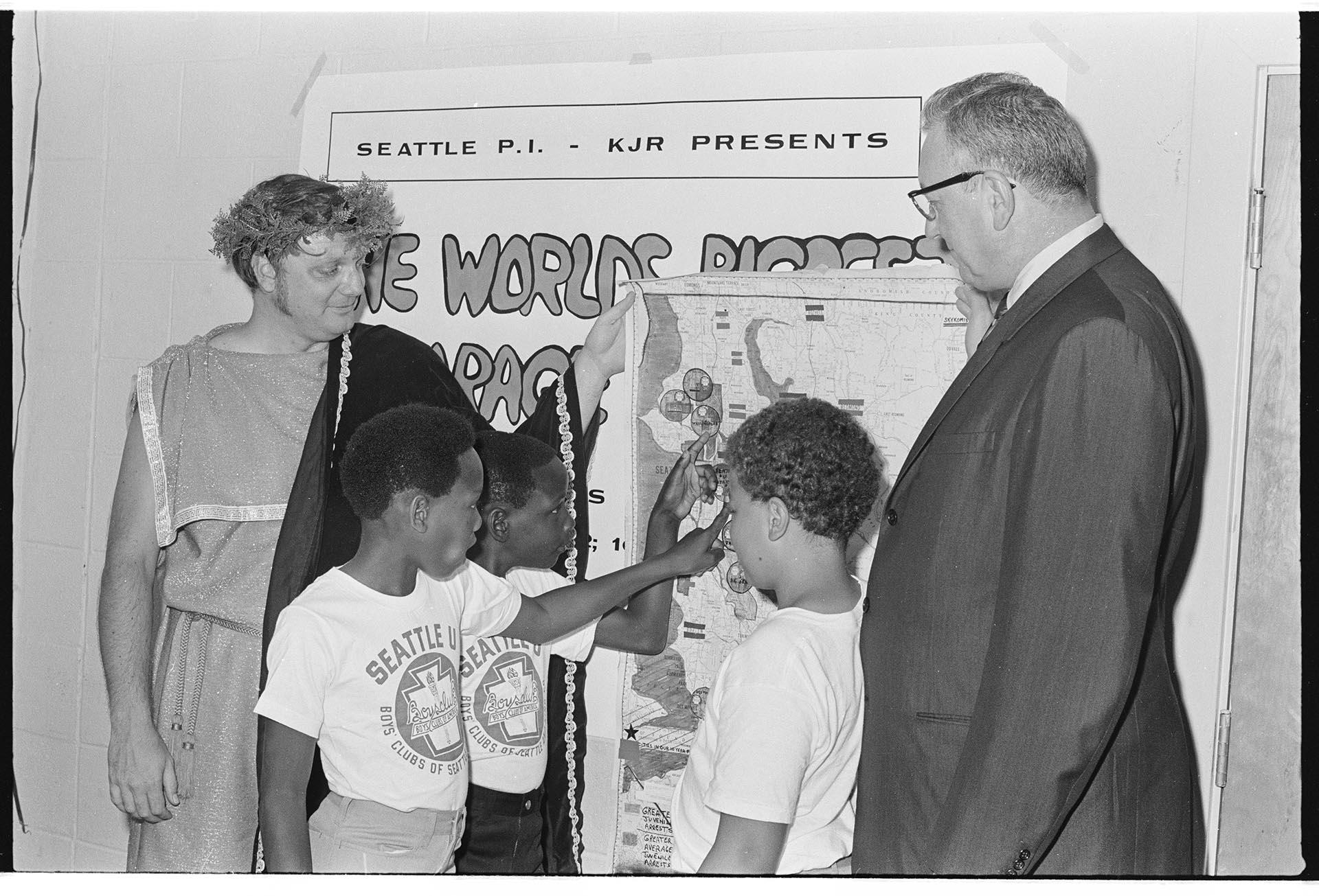 Image of Boys Club members and men with map, Seattle, August 11, 1970