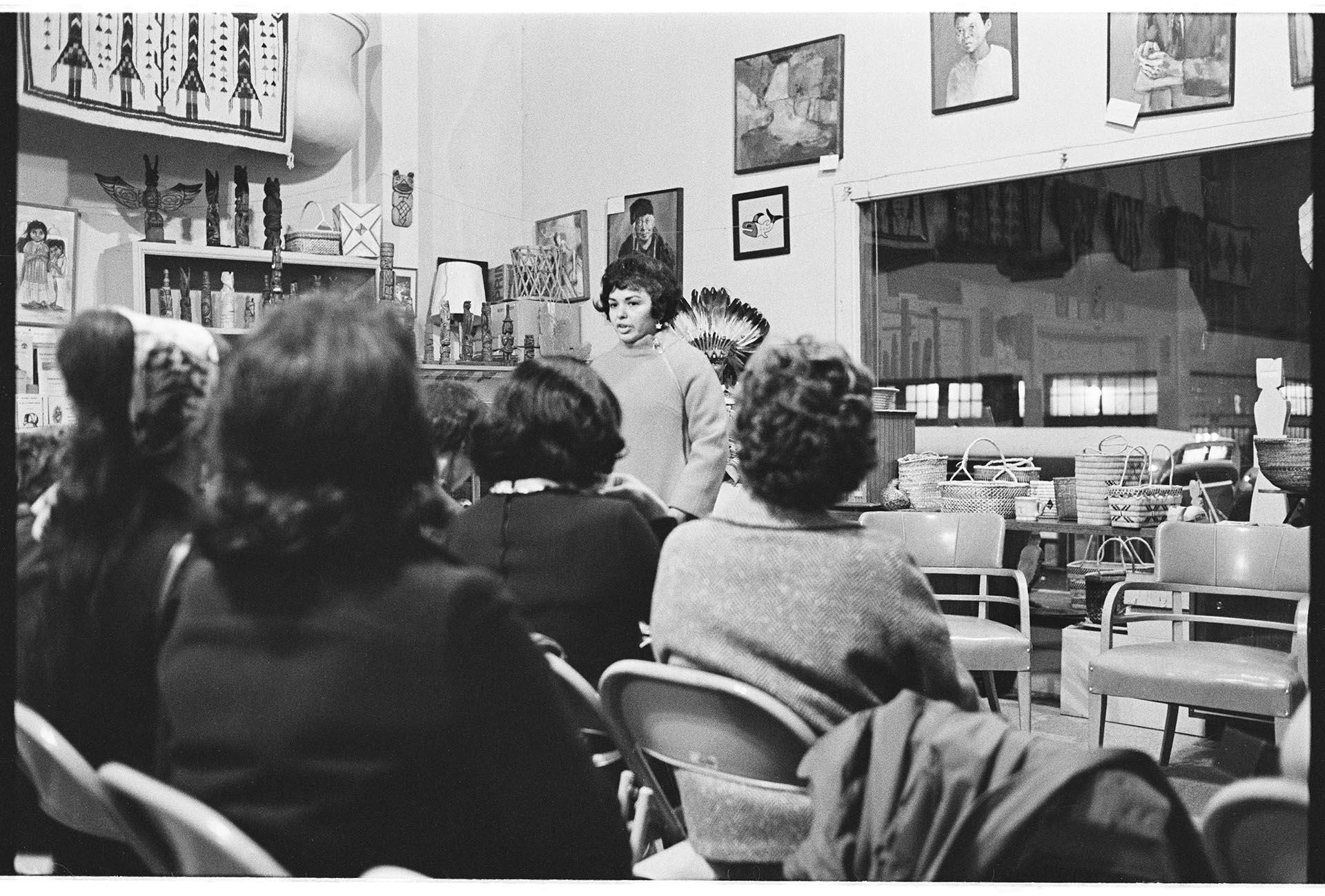 Image of AIWSL President Joyce Reyes speaking at meeting, Seattle, December 1970