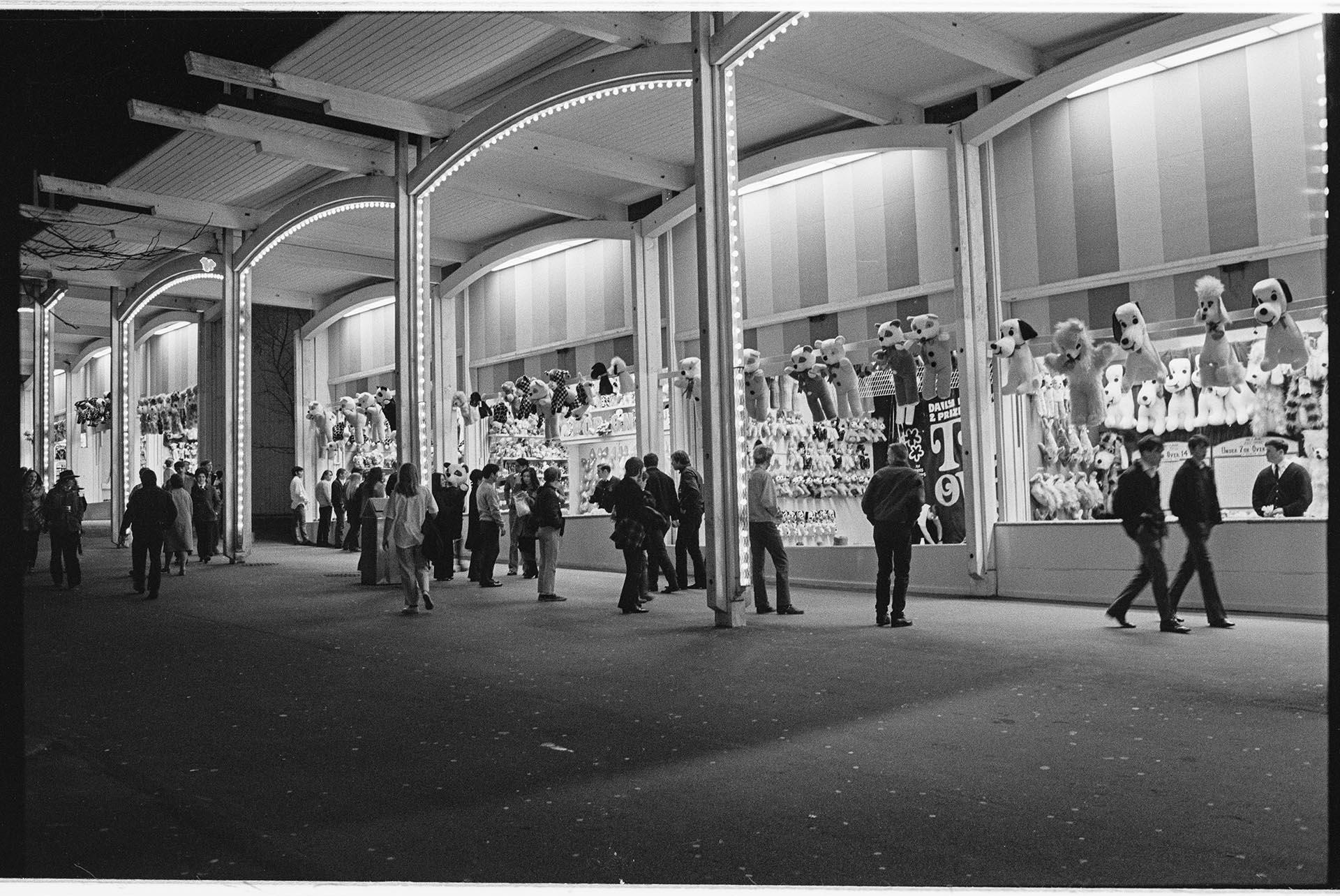 Image of Night view of games arcade at Fun Forest, Seattle Center, March 1971