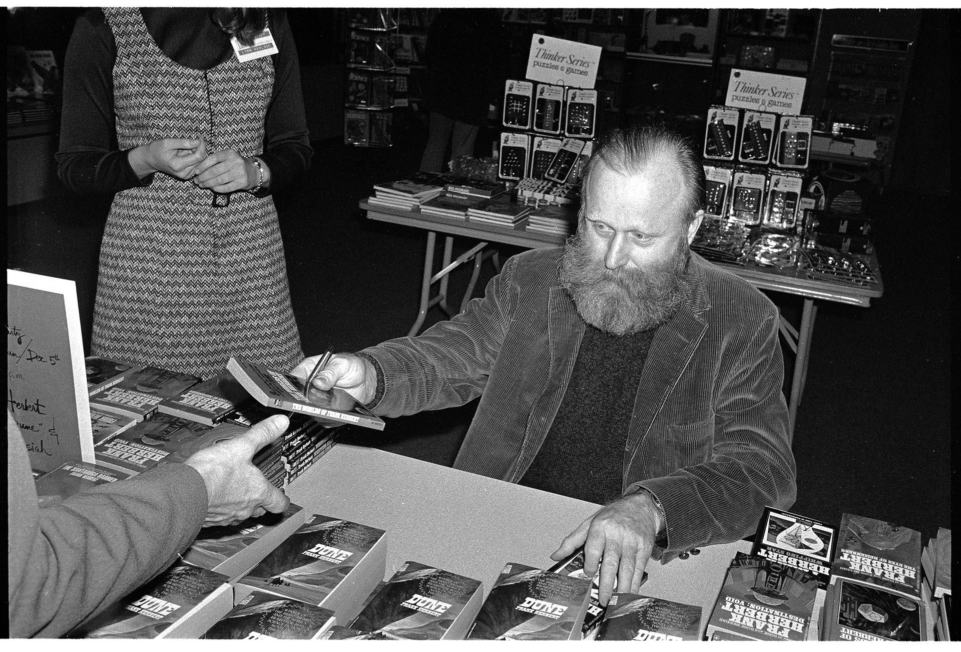 Image of Frank Herbert signing books, Seattle, December 5, 1971